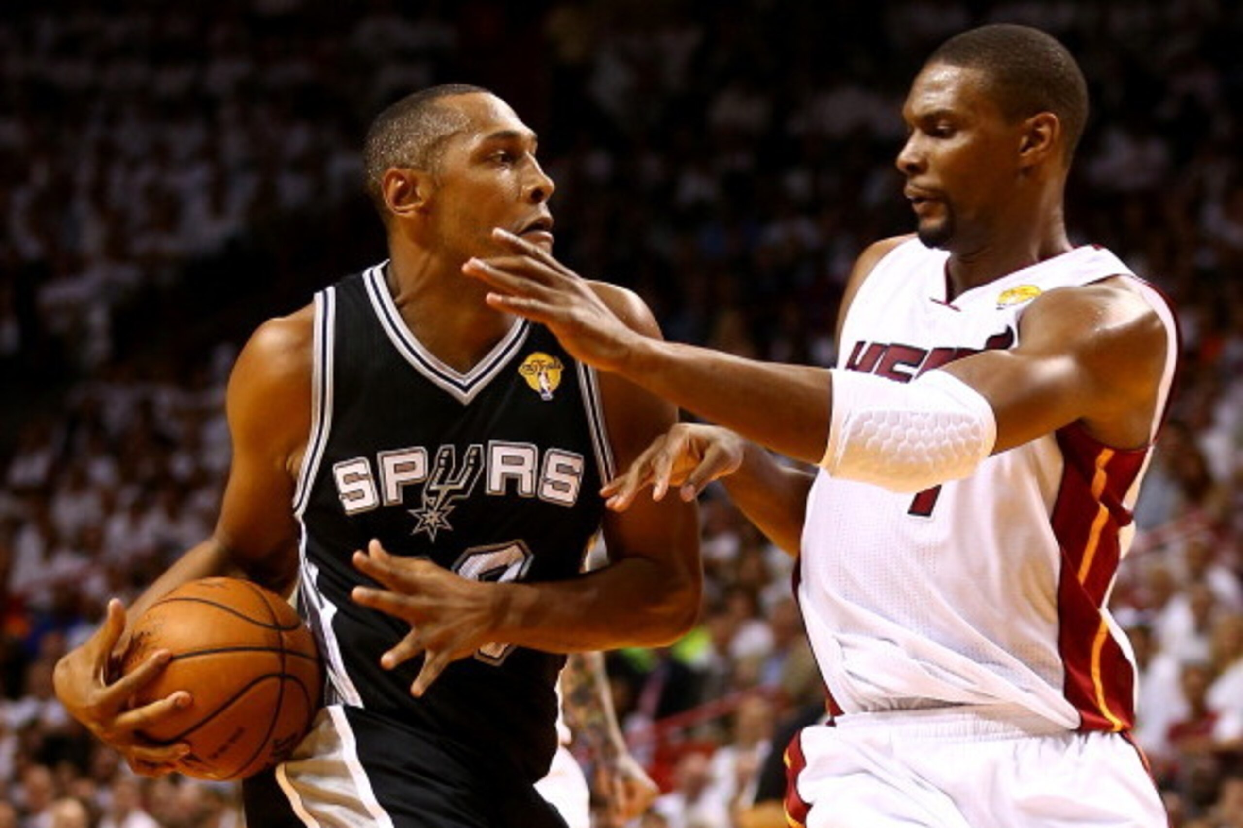 MIAMI, FL - JUNE 10: Boris Diaw #33 of the San Antonio Spurs drives to the basket against Chris Bosh #1 of the Miami Heat during Game Three of the 2014 NBA Finals at American Airlines Arena on June 10, 2014 in Miami, Florida. NOTE TO USER: User expressly MIAMI, FL - JUNE 10: Boris Diaw #33 of the San Antonio Spurs drives to the basket against Chris Bosh #1 of the Miami Heat during Game Three of the 2014 NBA Finals at American Airlines Arena on June 10, 2014 in Miami, Florida. NOTE TO USER: User expressly