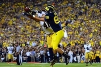 Sep 7, 2013; Ann Arbor, MI, USA; Michigan Wolverines tight end Jake Butt (88) is unable to make a catch while being defended by Notre Dame Fighting Irish safety Matthias Farley (41) during the second quarter at Michigan Stadium. Mandatory Credit: Andrew W