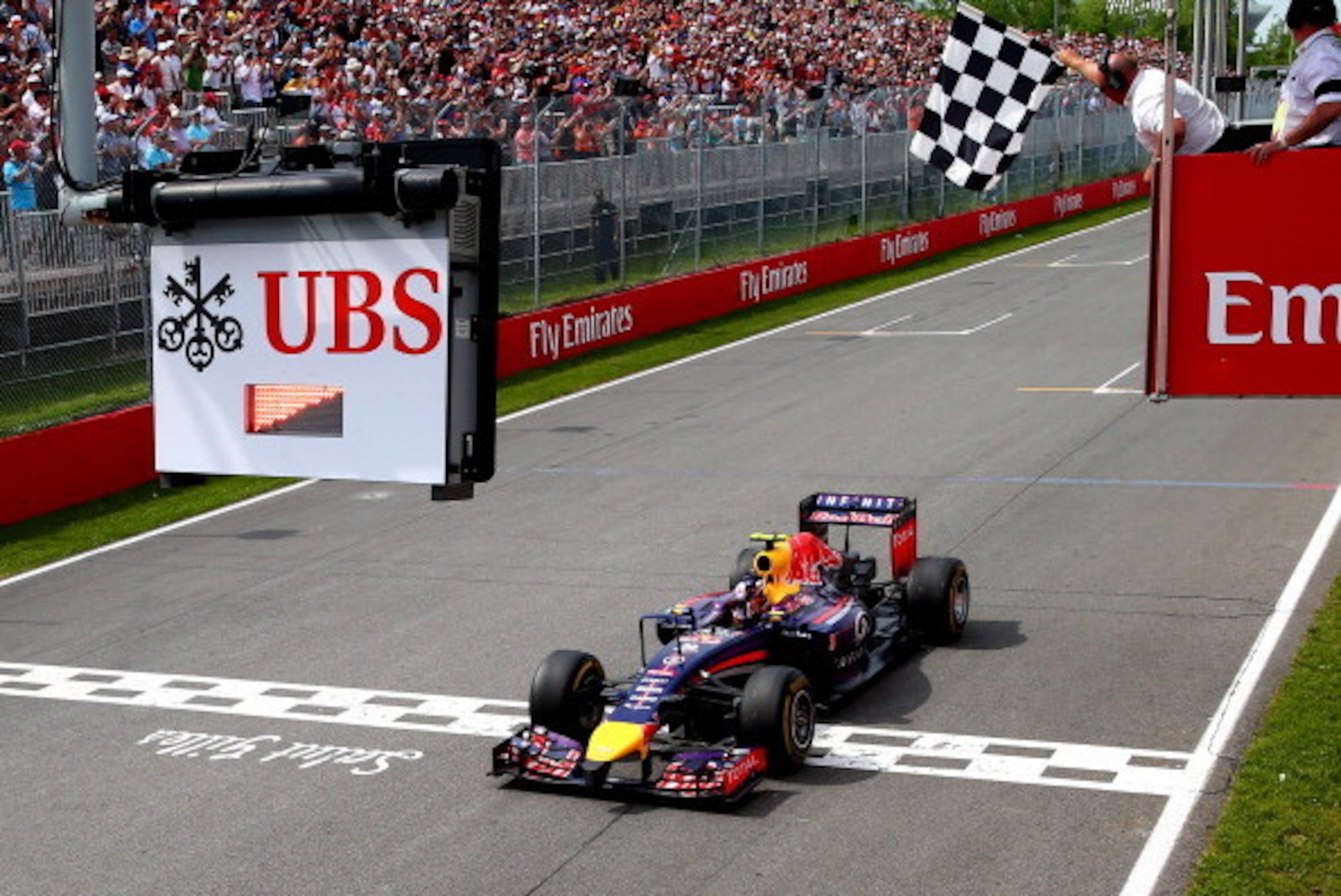 MONTREAL, QC - JUNE 08: Daniel Ricciardo of Australia and Infiniti Red Bull Racing crosses the finish line to take his first Grand Prix victory during the Canadian Formula One Grand Prix at Circuit Gilles Villeneuve on June 8, 2014 in Montreal, Canada. MONTREAL, QC - JUNE 08: Daniel Ricciardo of Australia and Infiniti Red Bull Racing crosses the finish line to take his first Grand Prix victory during the Canadian Formula One Grand Prix at Circuit Gilles Villeneuve on June 8, 2014 in Montreal, Canada.