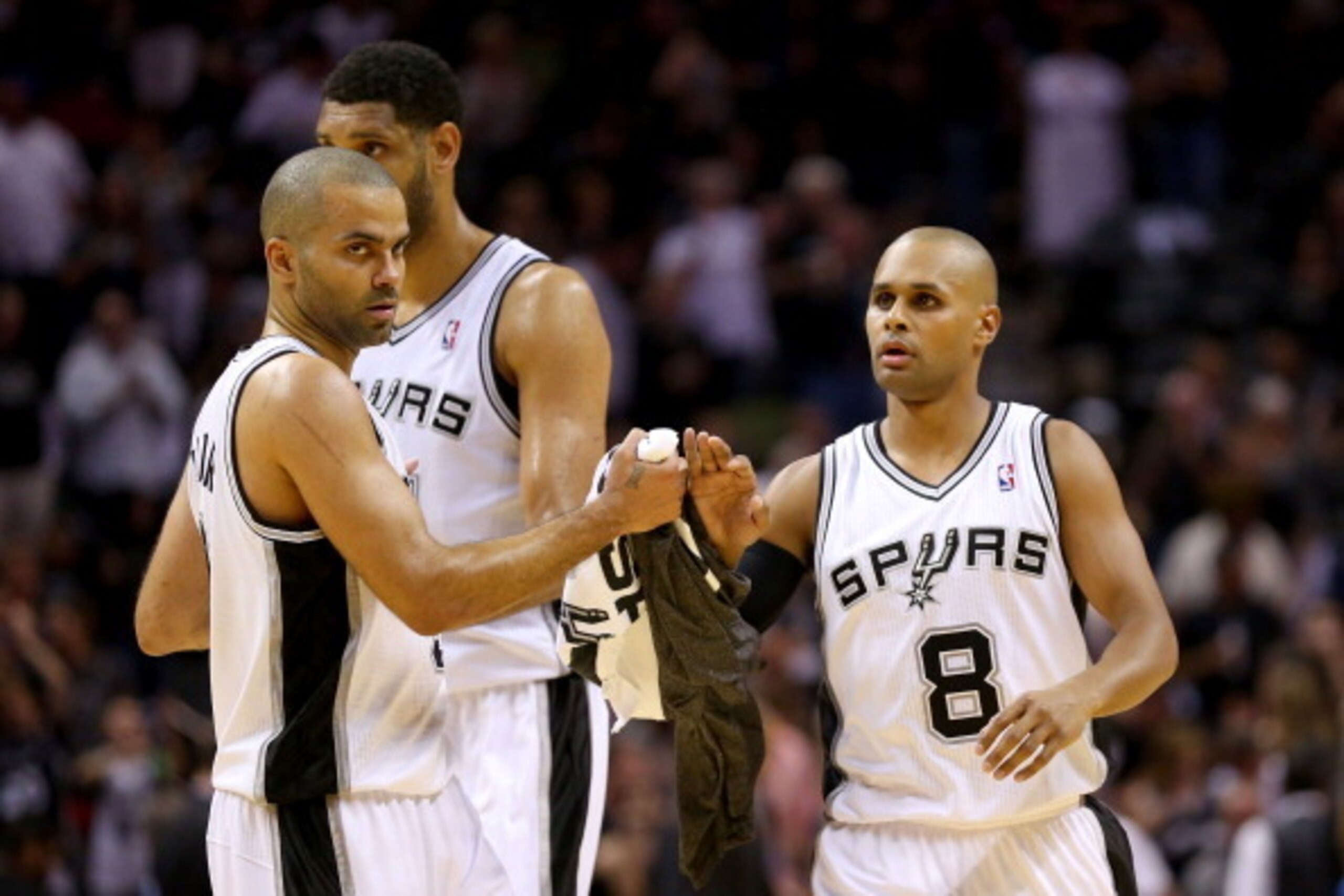 SAN ANTONIO, TX - MAY 21:  Patty Mills #8, Tony Parker #9 and Tim Duncan #21 of the San Antonio Spurs celebrate in the second quarter while taking on the Oklahoma City Thunder in Game Two of the Western Conference Finals during the 2014 NBA Playoffs at AT