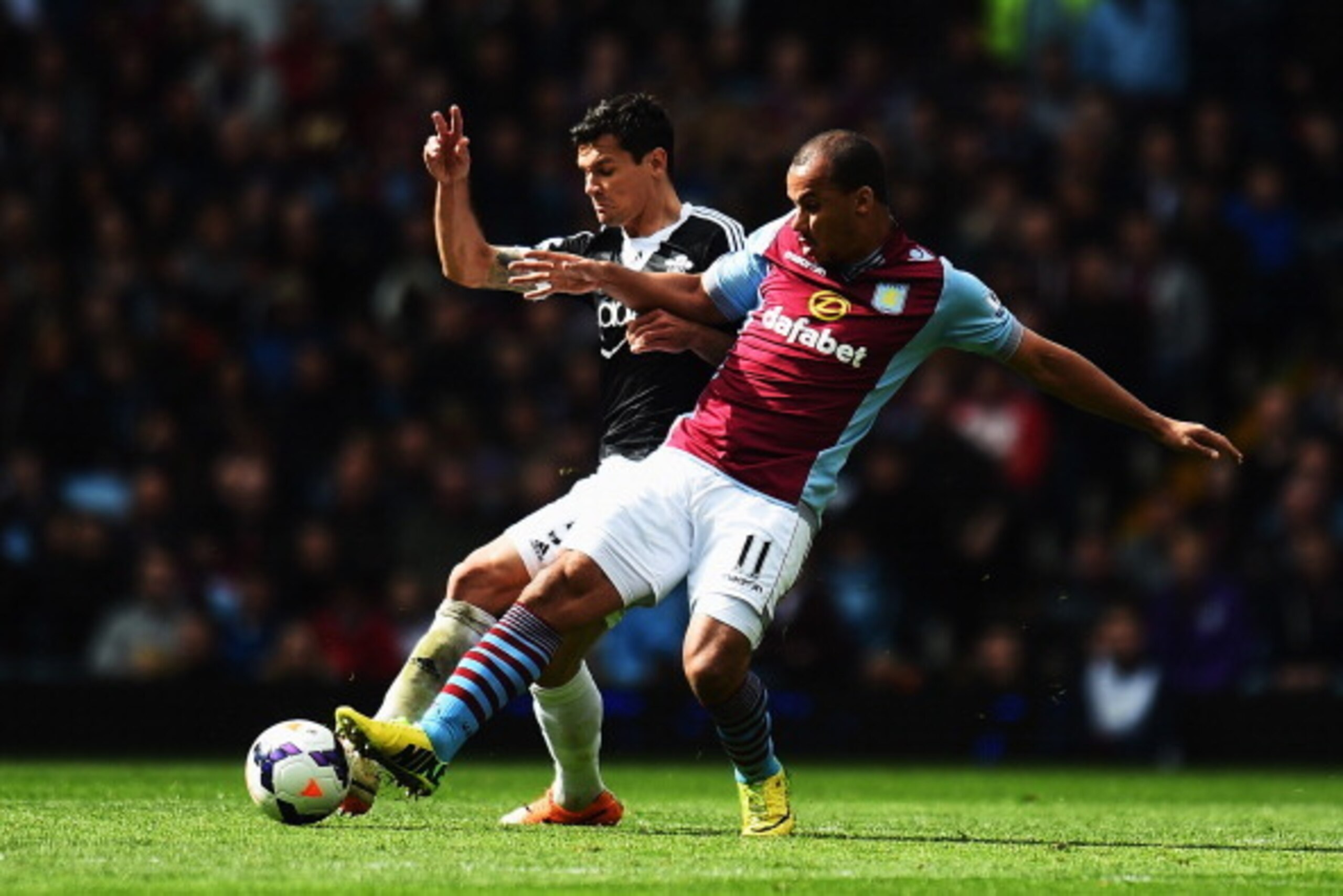 BIRMINGHAM, ENGLAND - APRIL 19: (L-R) Dejan Lovren of Southampton is challenged by Gabriel Agbonlahor of Aston Villa during the Barclays Premier League match between Aston Villa and Southampton at Villa Park on April 19, 2014 in Birmingham, England. (Ph BIRMINGHAM, ENGLAND - APRIL 19: (L-R) Dejan Lovren of Southampton is challenged by Gabriel Agbonlahor of Aston Villa during the Barclays Premier League match between Aston Villa and Southampton at Villa Park on April 19, 2014 in Birmingham, England. (Ph