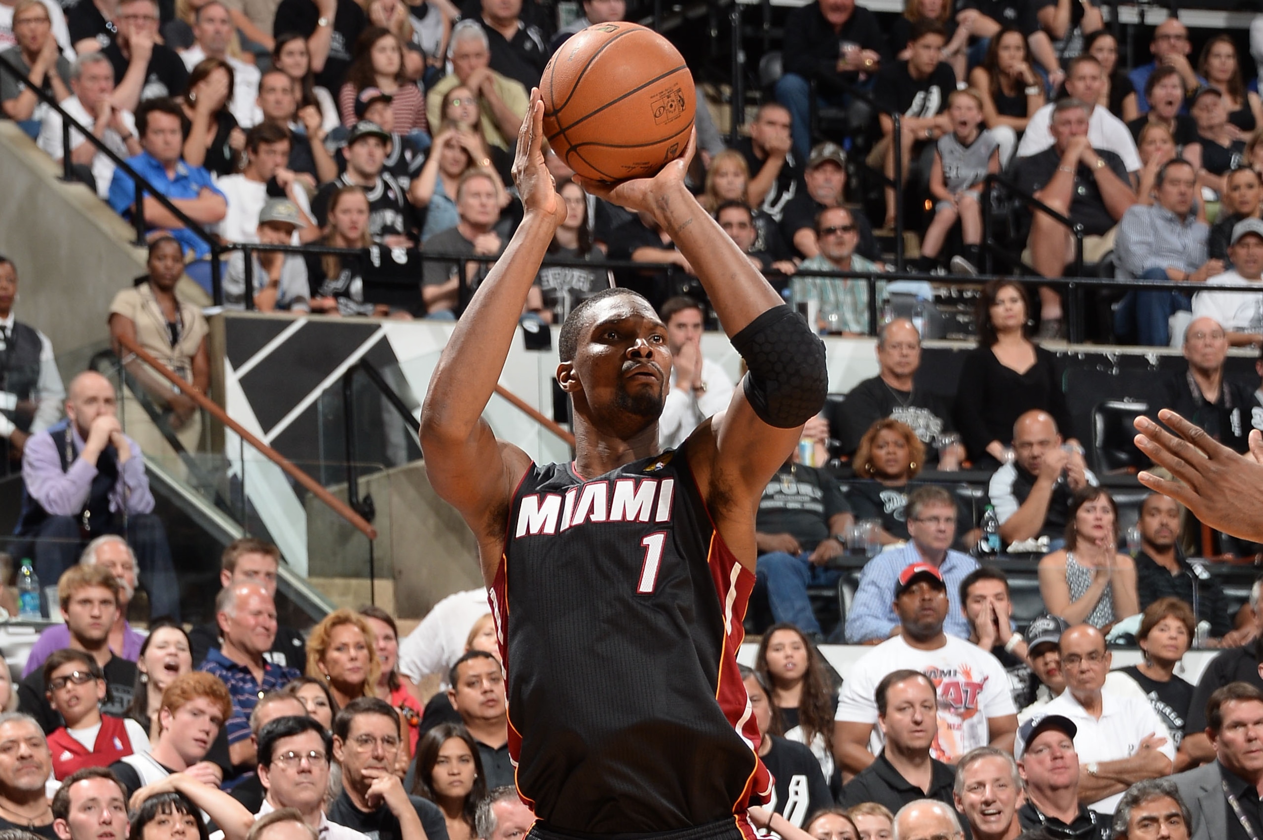 SAN ANTONIO, TX - JUNE 08: Chris Bosh #1 of the Miami Heat shoots during Game Two of the 2014 NBA Finals between the Miami Heat and San Antonio Spurs at AT&T Center on June 8, 2014 in San Antonio, Texas. NOTE TO USER: User expressly acknowledges and agree
