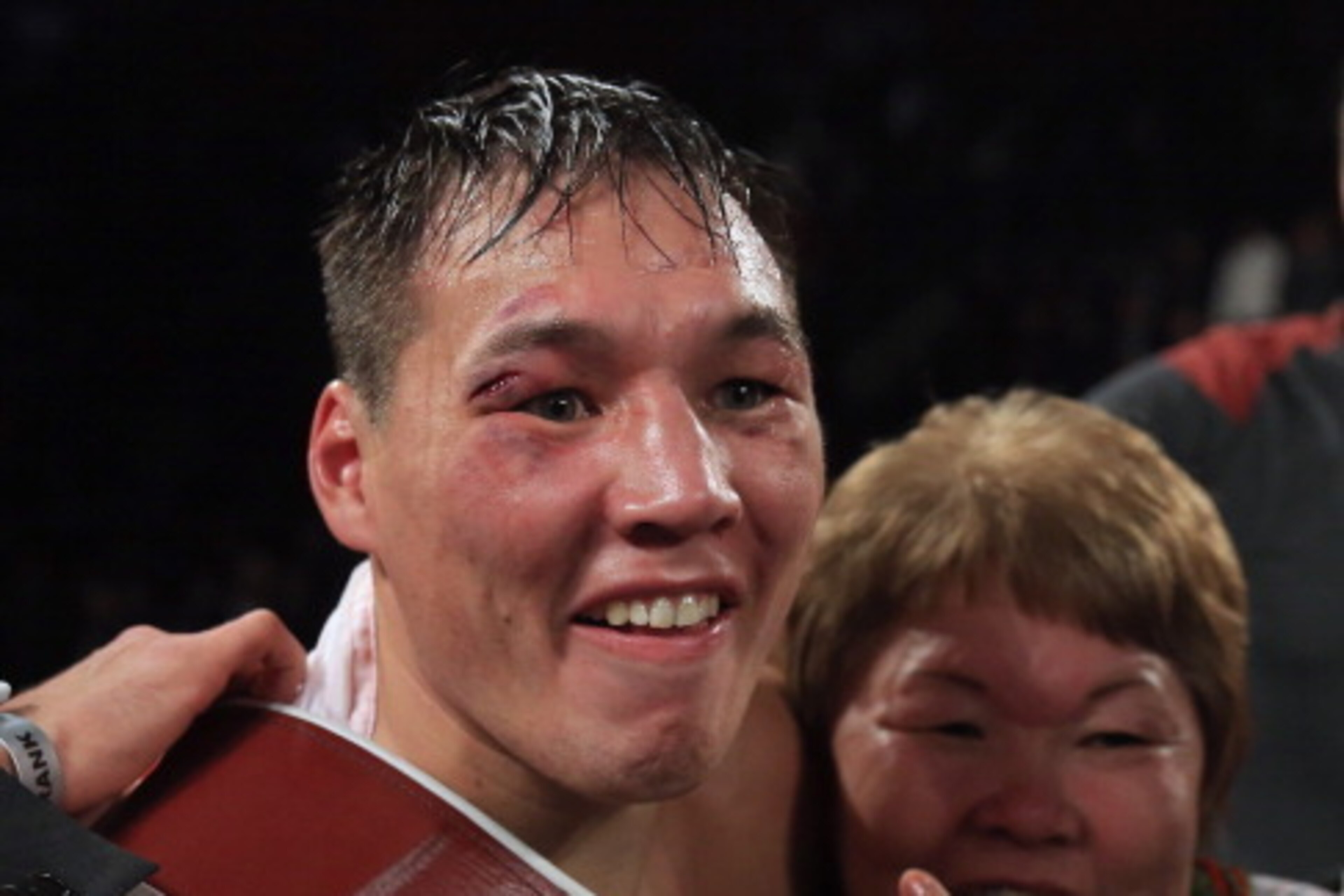BROOMFIELD, CO - OCTOBER 19:  Ruslan Provodnikov of Russia celebrates with his mother after defeating Mike Alvarado with a TKO in the 10th round to claim the WBO Junior Welterweight Title at the 1stBank Center on October 19, 2013 in Broomfield, Colorado. 