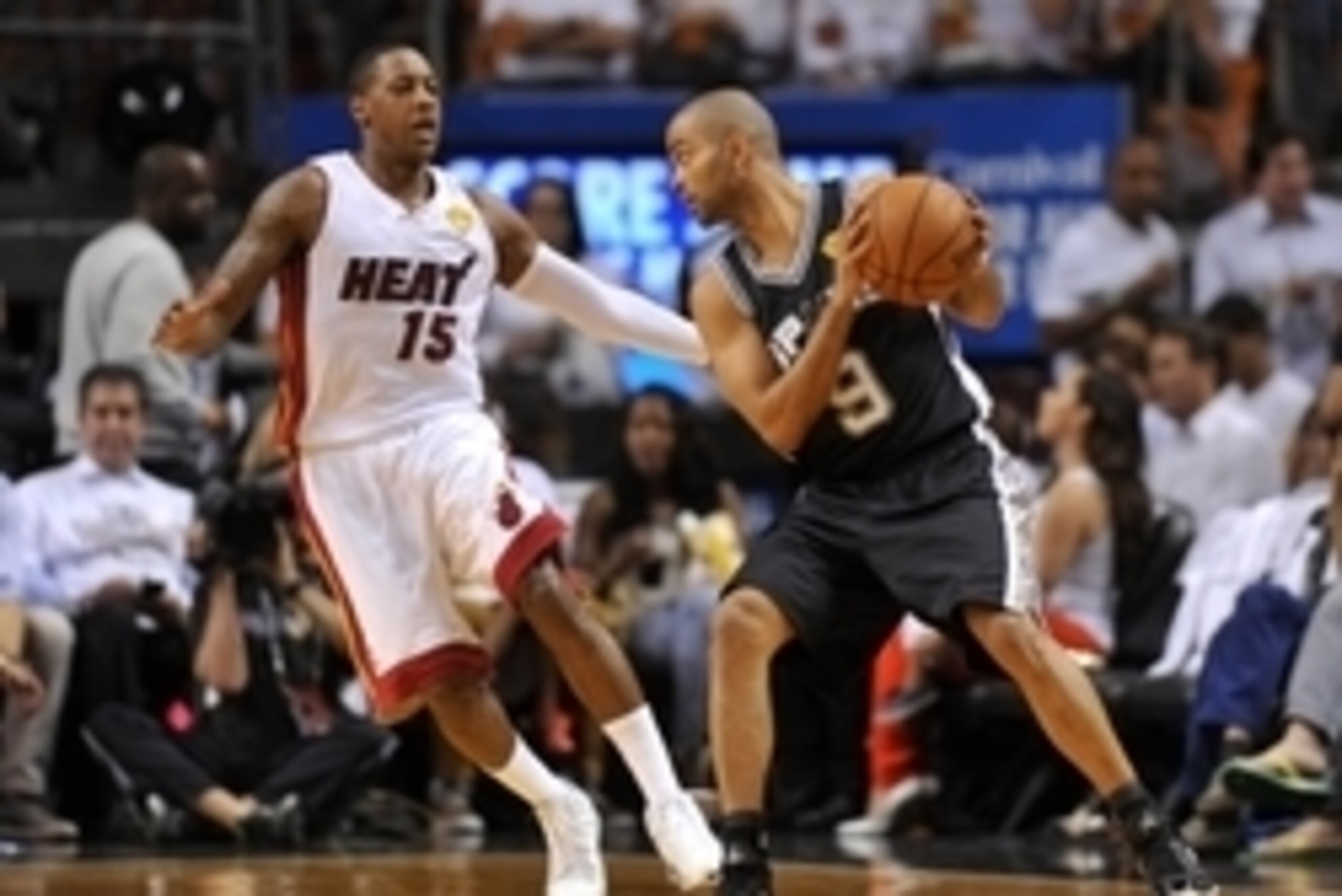 Jun 10, 2014; Miami, FL, USA; San Antonio Spurs guard Tony Parker (9) drives against Miami Heat guard Mario Chalmers (15) during the first half of game three of the 2014 NBA Finals at American Airlines Arena. Mandatory Credit: Steve Mitchell-USA TODAY Spo Jun 10, 2014; Miami, FL, USA; San Antonio Spurs guard Tony Parker (9) drives against Miami Heat guard Mario Chalmers (15) during the first half of game three of the 2014 NBA Finals at American Airlines Arena. Mandatory Credit: Steve Mitchell-USA TODAY Spo