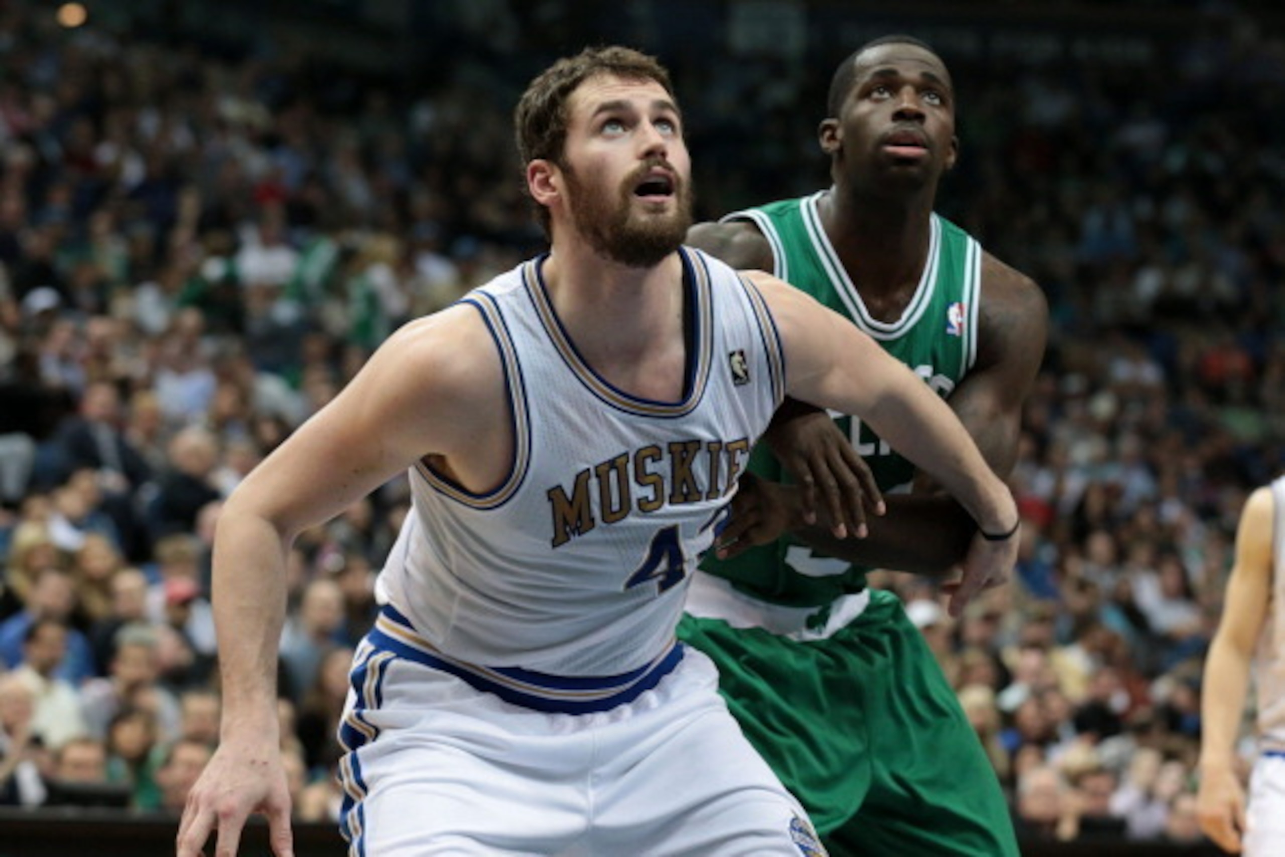 MINNEAPOLIS, MN - MARCH 30:  Kevin Love #42 of the Minnesota Timberwolves boxes out Brandon Bass #30 of the Boston Celtics as they wait for a rebound during the game on March 30, 2012 at Target Center in Minneapolis, Minnesota. NOTE TO USER: User expressl