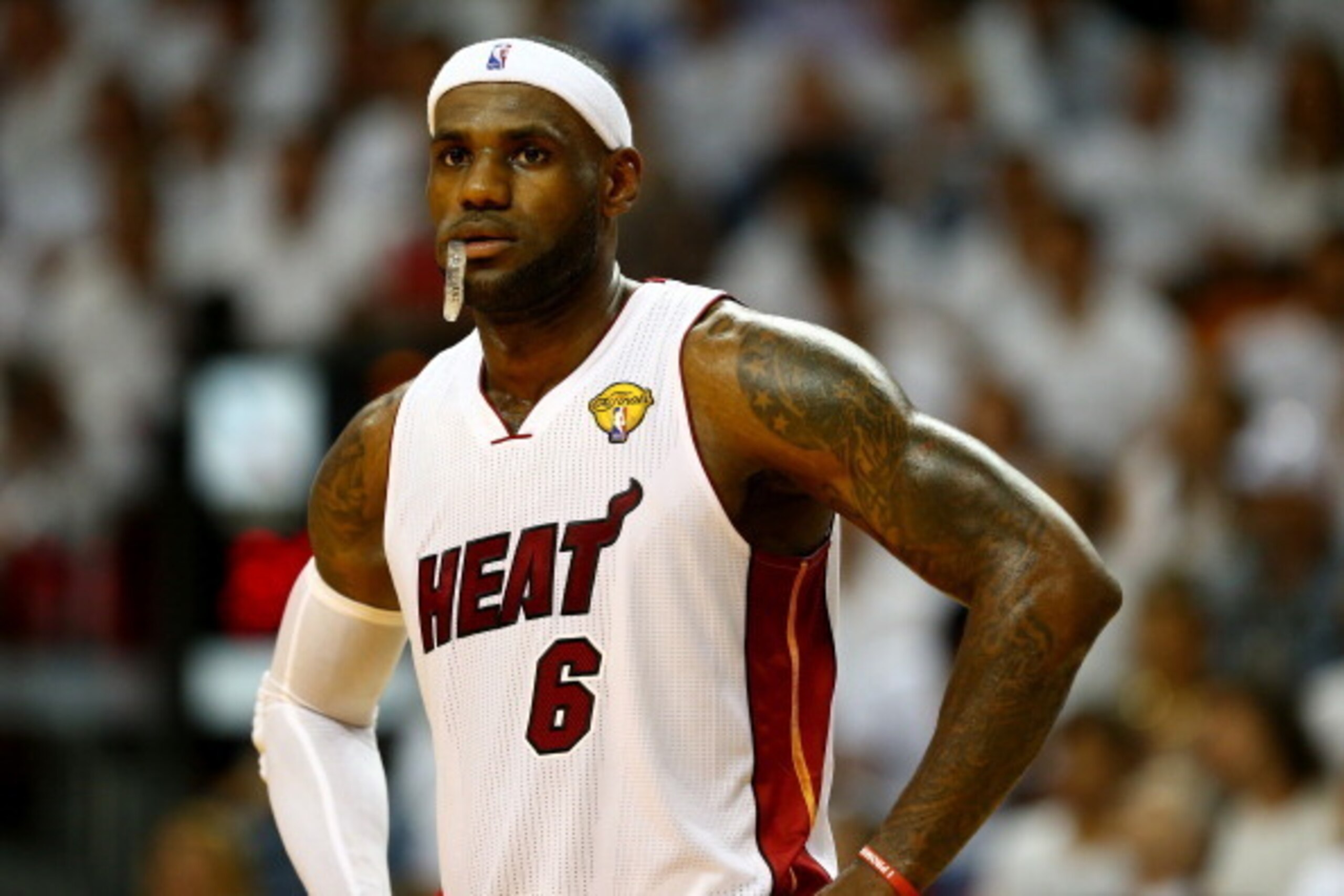 MIAMI, FL - JUNE 10:  LeBron James #6 of the Miami Heat looks on against the San Antonio Spurs during Game Three of the 2014 NBA Finals at American Airlines Arena on June 10, 2014 in Miami, Florida. NOTE TO USER: User expressly acknowledges and agrees tha