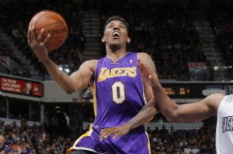 SACRAMENTO, CA - APRIL 2: Nick Young #0 of the Los Angeles Lakers puts up a shot against Rudy Gay #8 of the Sacramento Kings on April 2, 2014 at Sleep Train Arena in Sacramento, California. NOTE TO USER: User expressly acknowledges and agrees that, by dow