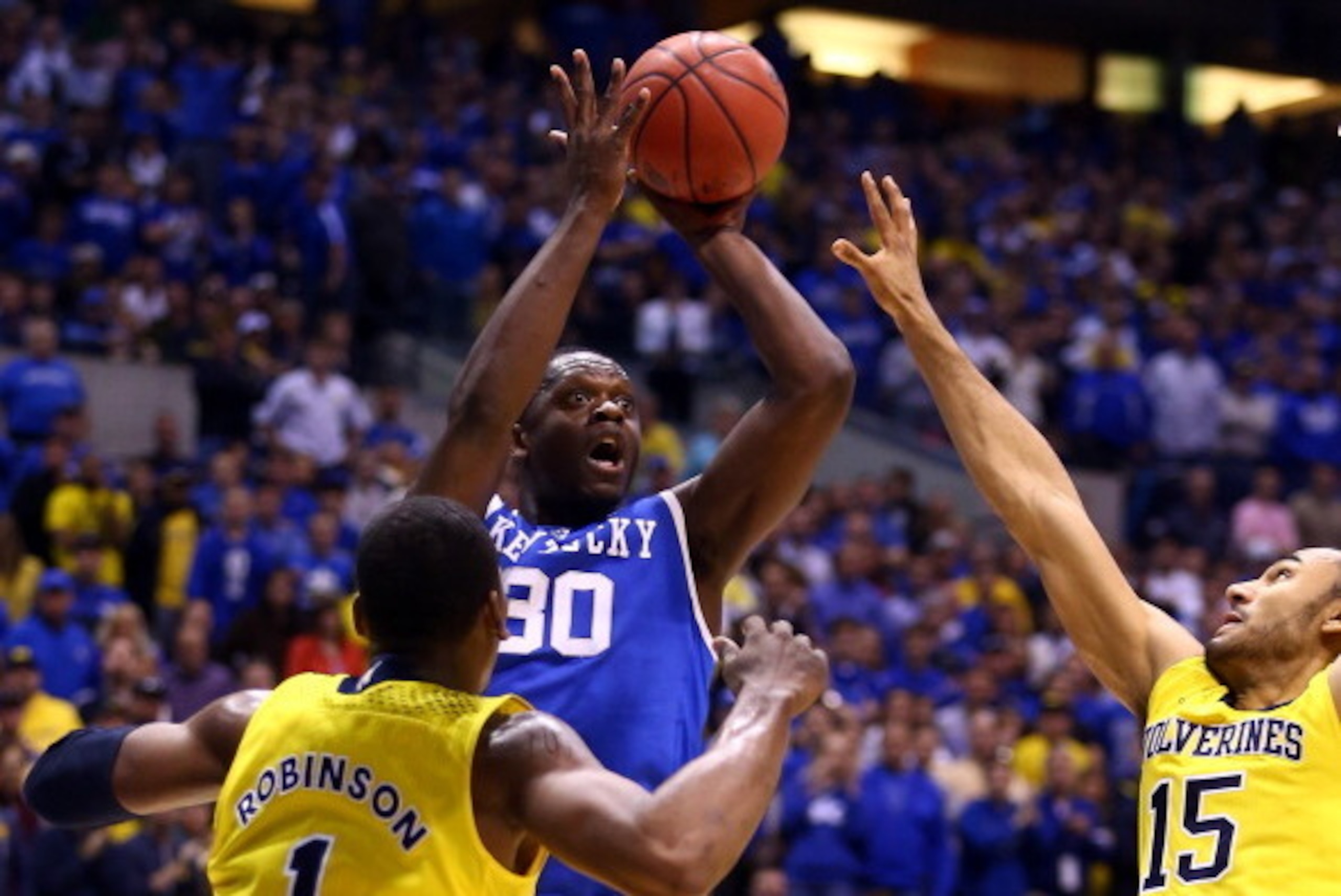 INDIANAPOLIS, IN - MARCH 30: Julius Randle #30 of the Kentucky Wildcats shoots the ball aginst Jon Horford #15 of the Michigan Wolverines in the first half during the midwest regional final of the 2014 NCAA Men's Basketball Tournament at Lucas Oil Stadiu INDIANAPOLIS, IN - MARCH 30: Julius Randle #30 of the Kentucky Wildcats shoots the ball aginst Jon Horford #15 of the Michigan Wolverines in the first half during the midwest regional final of the 2014 NCAA Men's Basketball Tournament at Lucas Oil Stadiu
