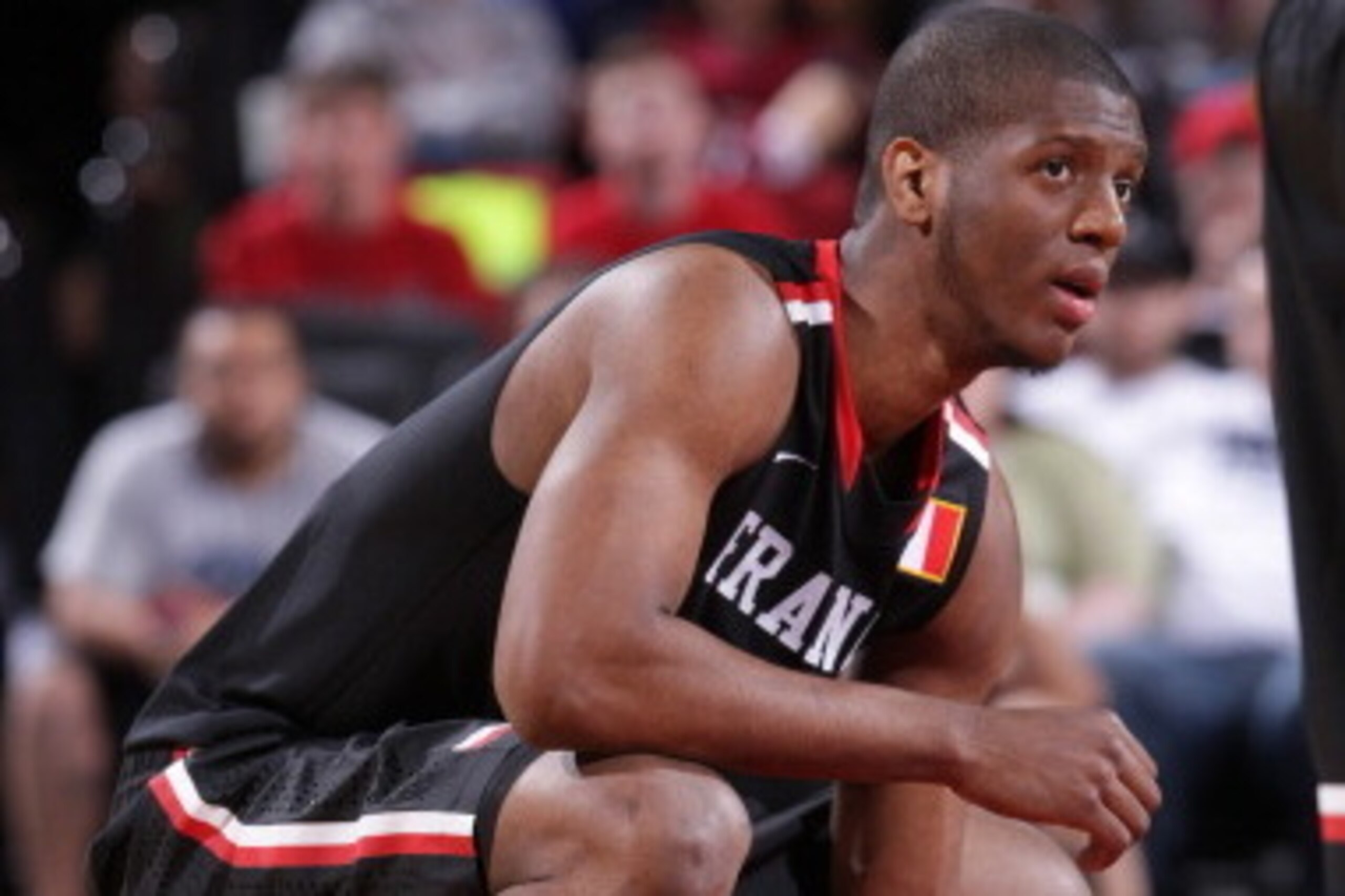 PORTLAND, OR - APRIL 12:  Damien Inglis #8 of the World Team squats on the court during the game against Team USA on April 12, 2014 at the Moda Center Arena in Portland, Oregon. NOTE TO USER: User expressly acknowledges and agrees that, by downloading and