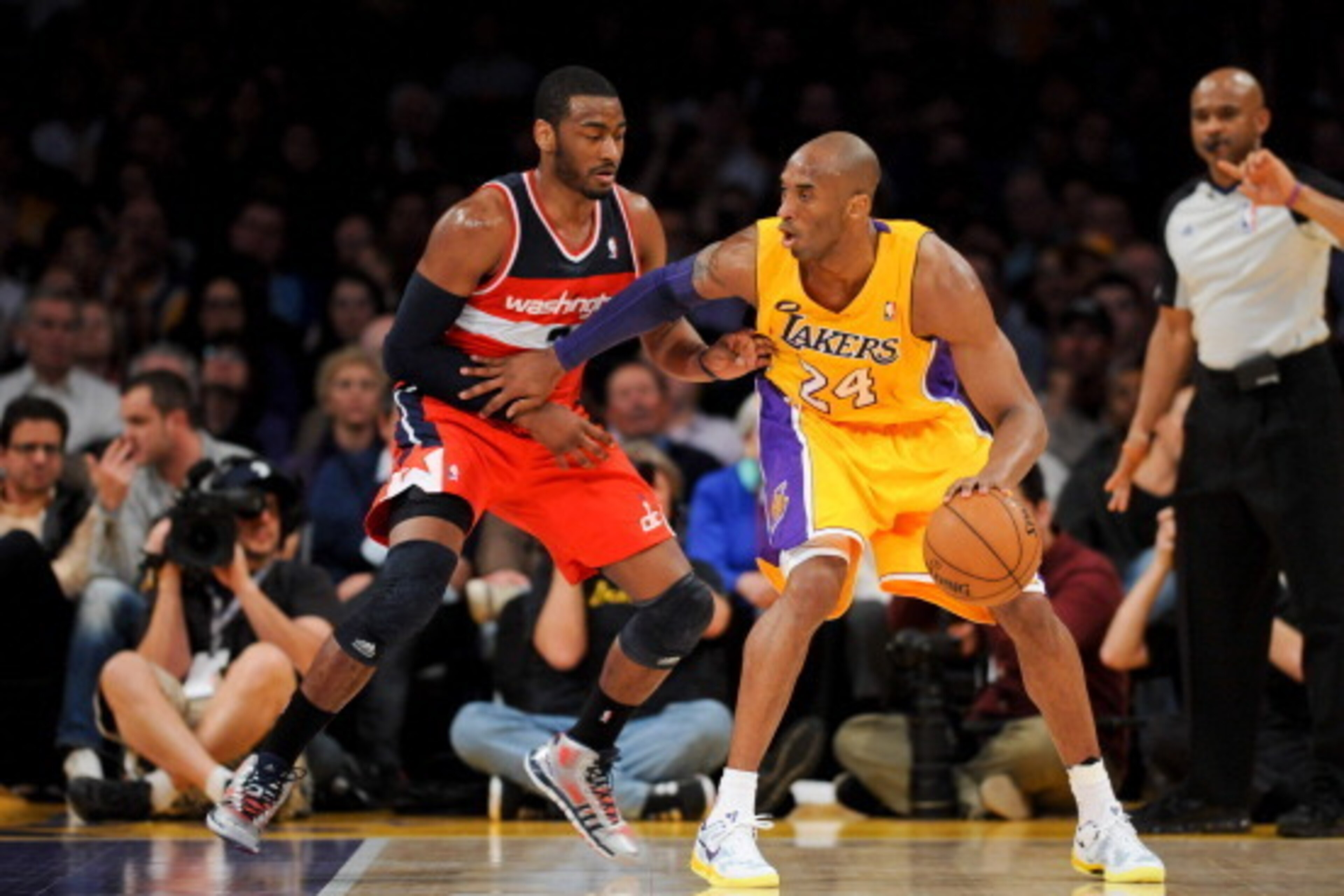 LOS ANGELES, CA - MARCH 22: Kobe Bryant #24 of the Los Angeles Lakers posts up against John Wall #2 of the Washington Wizards at Staples Center on March 22, 2013 in Los Angeles, California. NOTE TO USER: User expressly acknowledges and agrees that, by dow