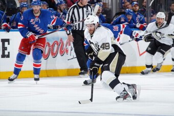 NEW YORK, NY - MAY 11:  Brian Gibbons #49 of the Pittsburgh Penguins skates with the puck against the New York Rangers in Game Six of the Second Round of the 2014 Stanley Cup Playoffs at Madison Square Garden on May 11, 2014 in New York City. The New York