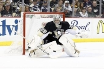 Apr 26, 2014; Pittsburgh, PA, USA; Pittsburgh Penguins goalie Marc-Andre Fleury (29) makes a save against the Columbus Blue Jackets during the third period in game five of the first round of the 2014 Stanley Cup Playoffs at the CONSOL Energy Center. The P