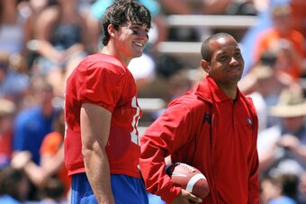 GAINESVILLE, FL - APRIL 10:  Quarterback John Brantley #12 of the Florida Gators stands with former Gator quarterback Chris Leak during the Orange & Blue game at Ben Hill Griffin Stadium on April 10, 2010 in Gainesville, Florida.  (Photo by Doug Benc/Gett