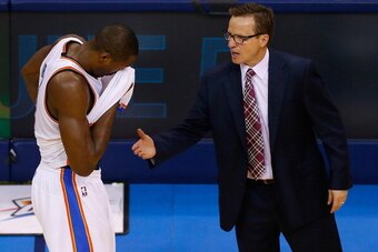 OKLAHOMA CITY, OK - MAY 31:  Serge Ibaka #9 of the Oklahoma City Thunder walks off the court to his coach Scott Brooks after the San Antonio Spurs defeated the Thunder 112-107 in overtime during Game Six of the Western Conference Finals of the 2014 NBA Pl