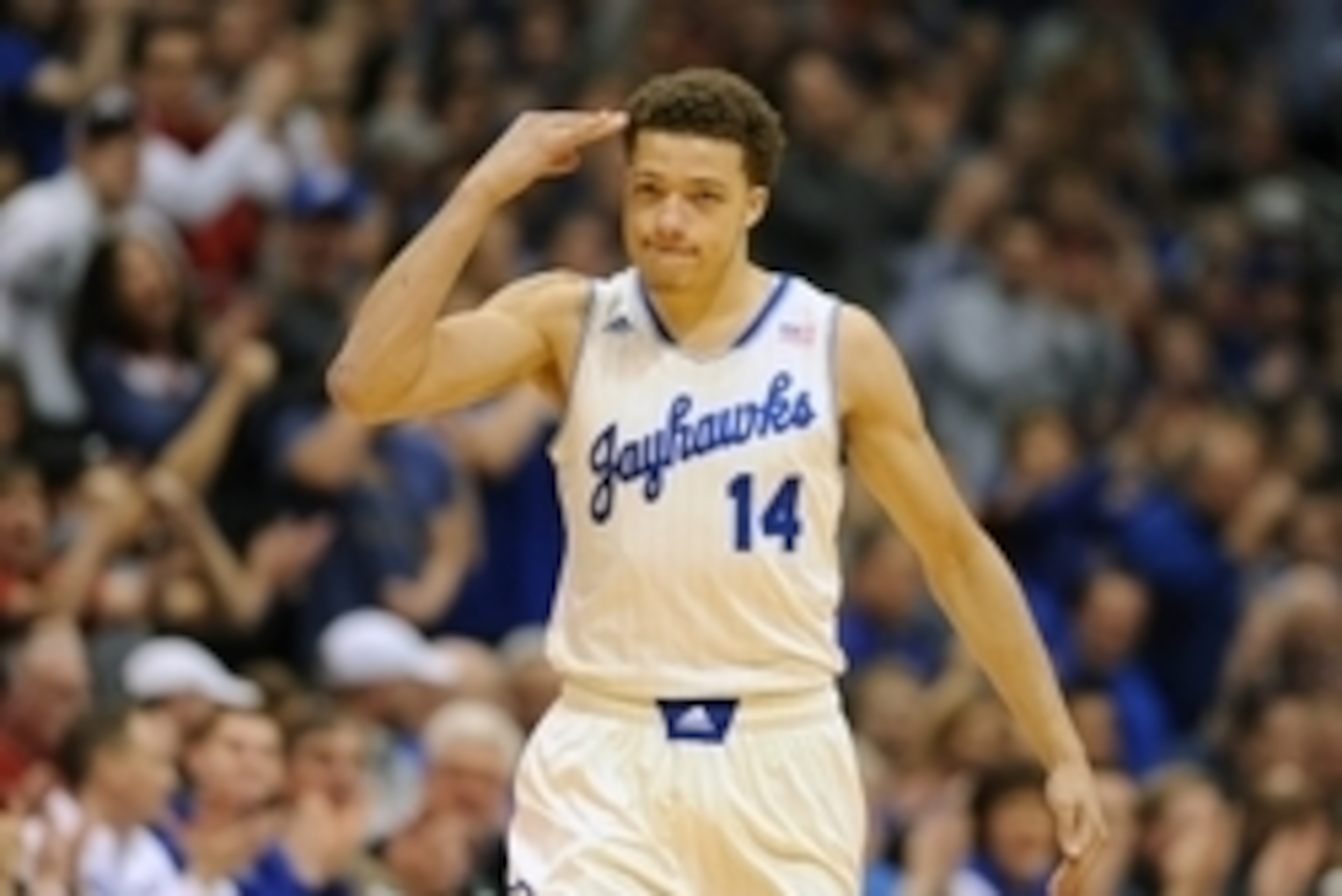 Jan 20, 2014; Lawrence, KS, USA; Kansas Jayhawks guard Brannen Greene (14) celebrates after scoring a three point shot during the first half against the Kansas Jayhawks at Allen Fieldhouse. Mandatory Credit: Denny Medley-USA TODAY Sports