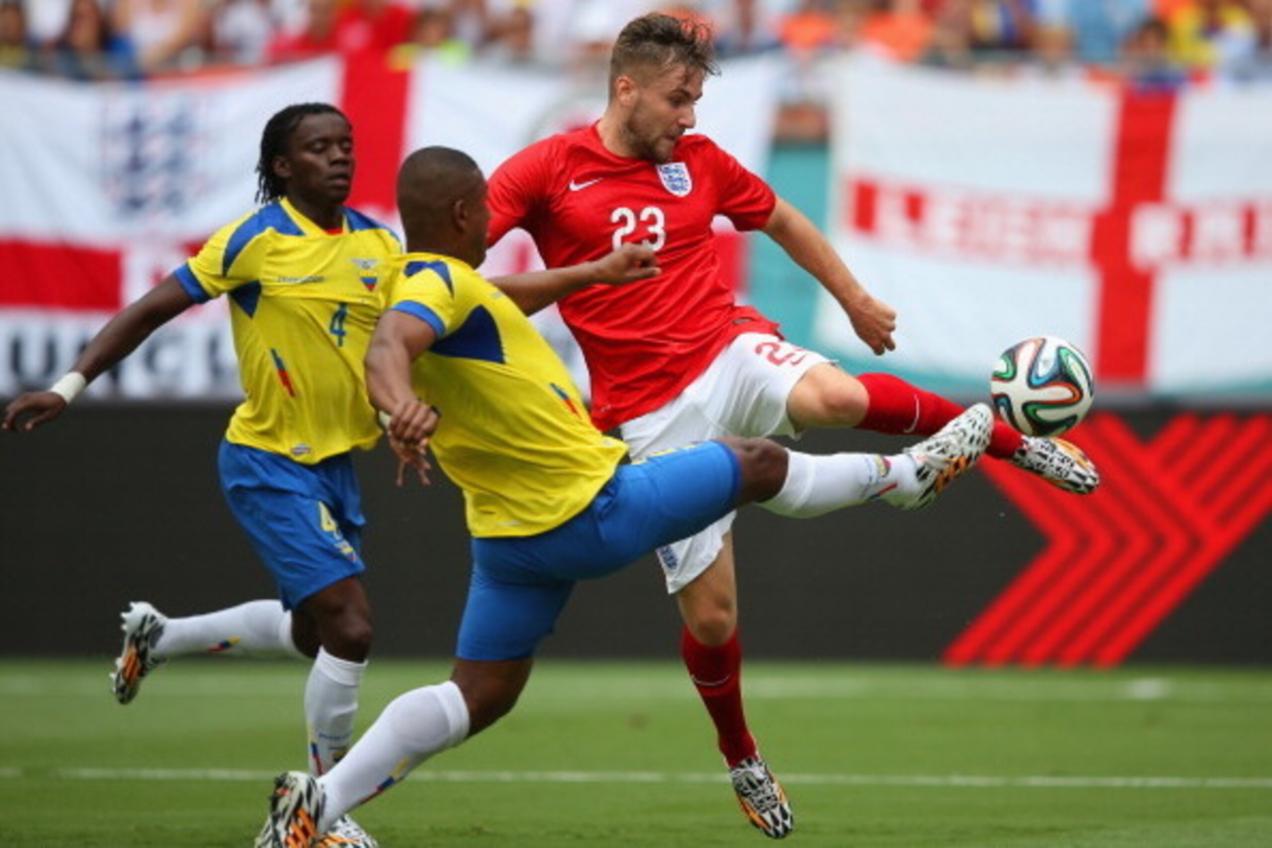 MIAMI GARDENS, FL - JUNE 04:  Luke Shaw of England and Jorge Guagua of Ecuador battle for the ball during the International friendly match between England and Ecuador at Sun Life Stadium on June 4, 2014 in Miami Gardens, Florida.  (Photo by Richard Heathc