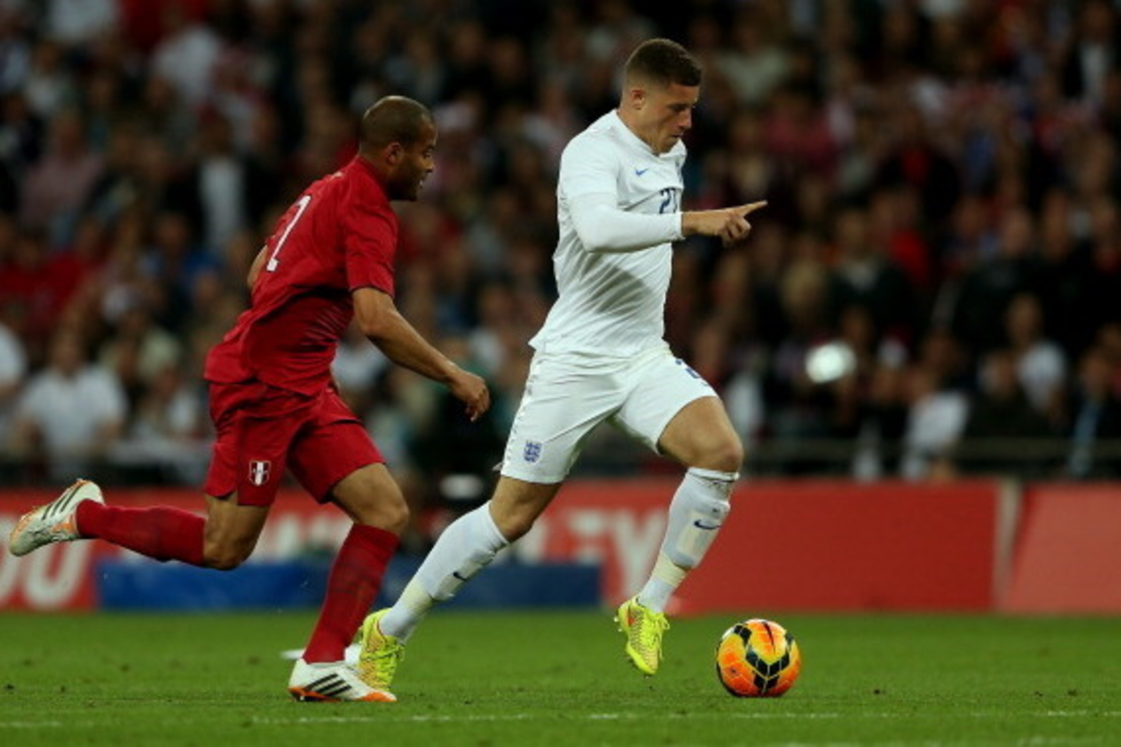 LONDON, ENGLAND - MAY 30: Alberto Rodriguez of Peru closes down Ross Barkley of England during the international friendly match between England and Peru at Wembley Stadium on May 30, 2014 in London, England.  (Photo by Warren Little/Getty Images)