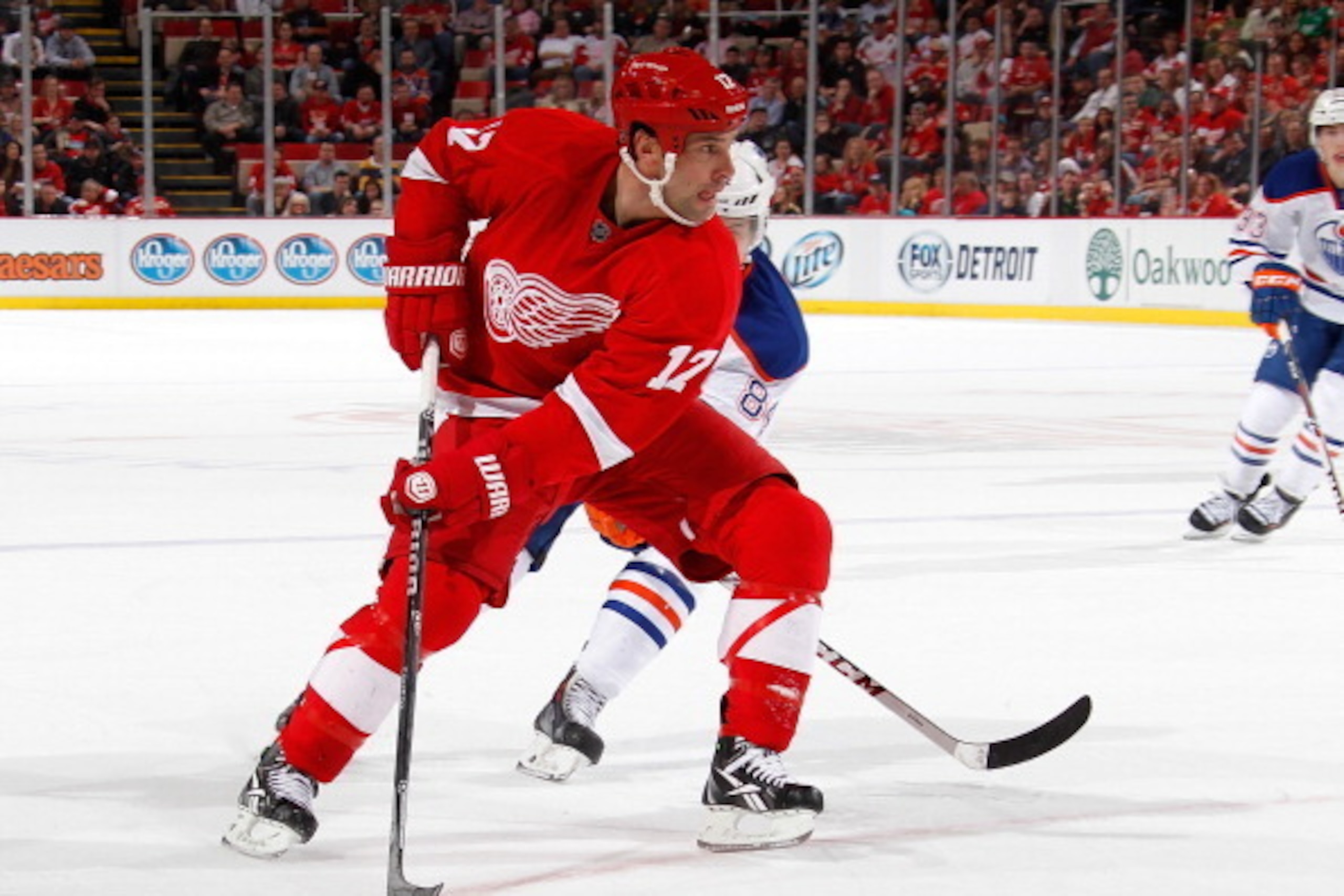 DETROIT, MI - MARCH 14:  David Legwand #17 of the Detroit Red Wings looks to pass against Oscar Klefbom #84 of the Edmonton Oilers during the second period at Joe Louis Arena on March 14, 2014 in Detroit, Michigan. (Photo by Gregory Shamus/Getty Images)