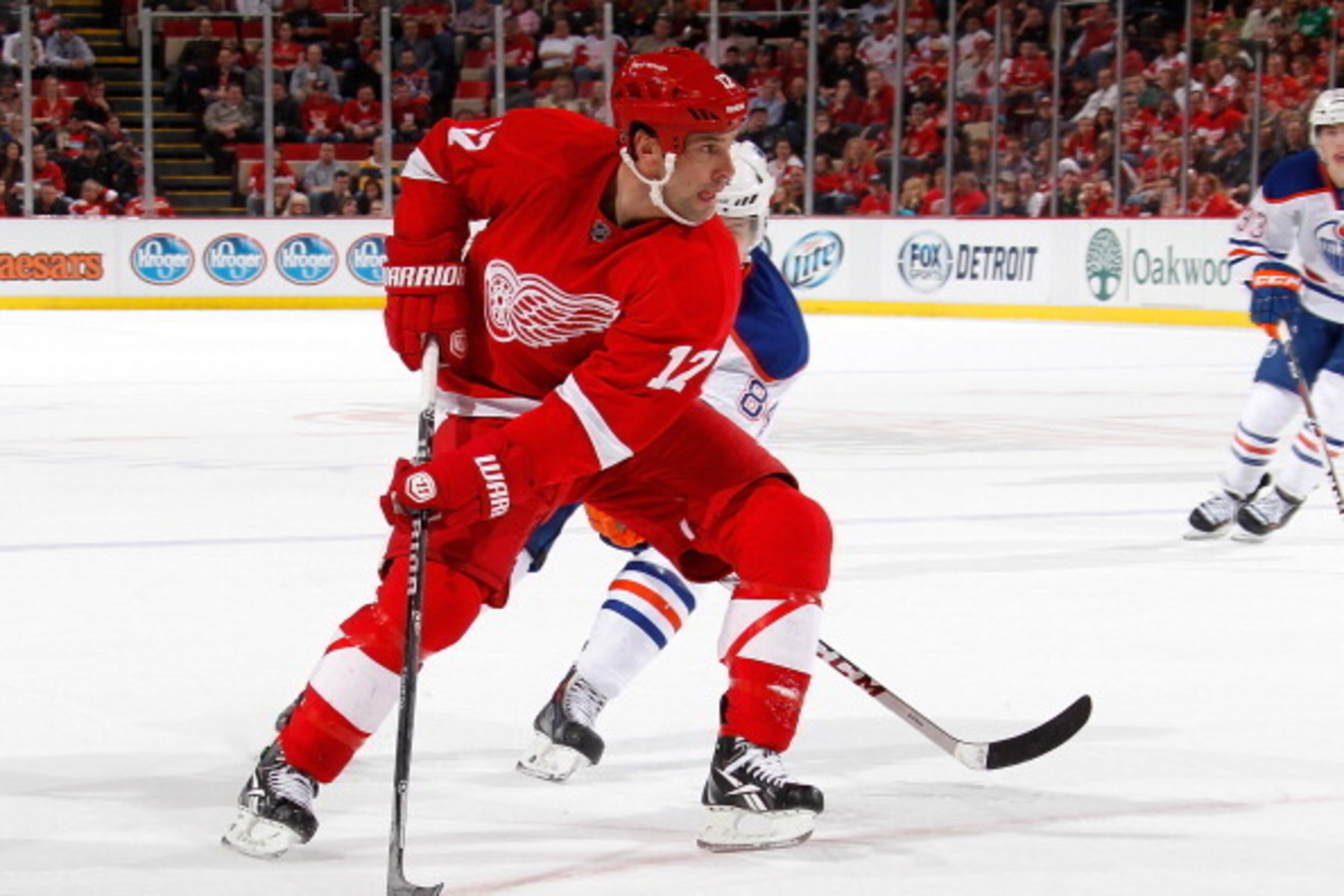 DETROIT, MI - MARCH 14:  David Legwand #17 of the Detroit Red Wings looks to pass against Oscar Klefbom #84 of the Edmonton Oilers during the second period at Joe Louis Arena on March 14, 2014 in Detroit, Michigan. (Photo by Gregory Shamus/Getty Images)