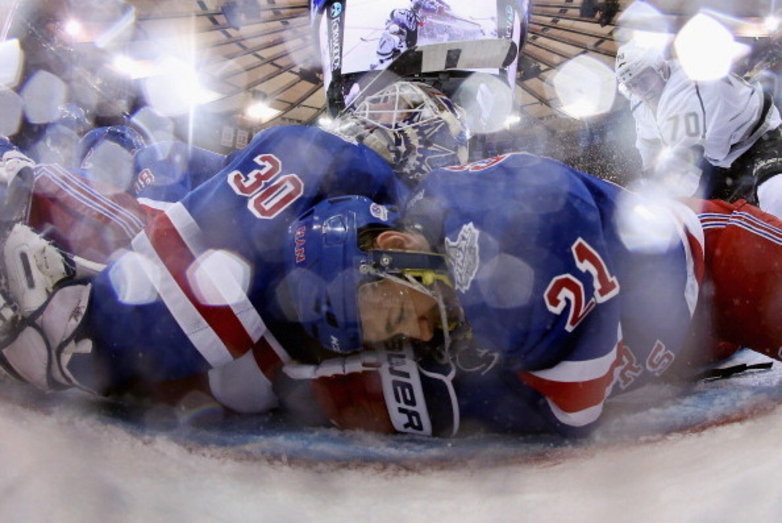 NEW YORK, NY - JUNE 11:  Derek Stepan #21 of the New York Rangers lies on the ice after clearing the puck from the goal line behind Henrik Lundqvist #30 of the New York Rangers during the third period of Game Four of the 2014 NHL Stanley Cup Final at Madi