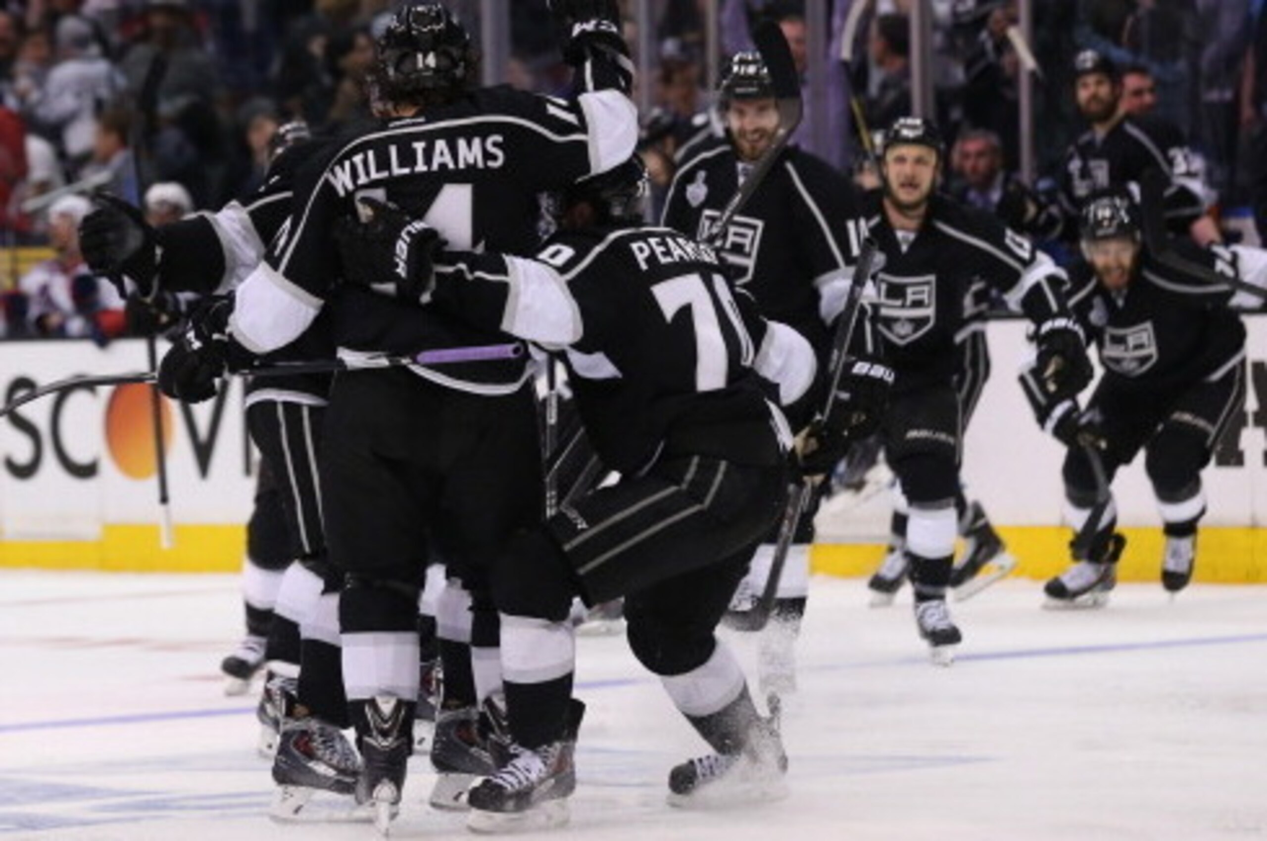 LOS ANGELES, CA - JUNE 04:  Justin Williams #14 of the Los Angeles Kings and teammates celebrate Williams overtime game-winner against the New York Rangers as the Kings defeated the Rangers 3-2 during Game One of the 2014 NHL Stanley Cup Final at the Stap