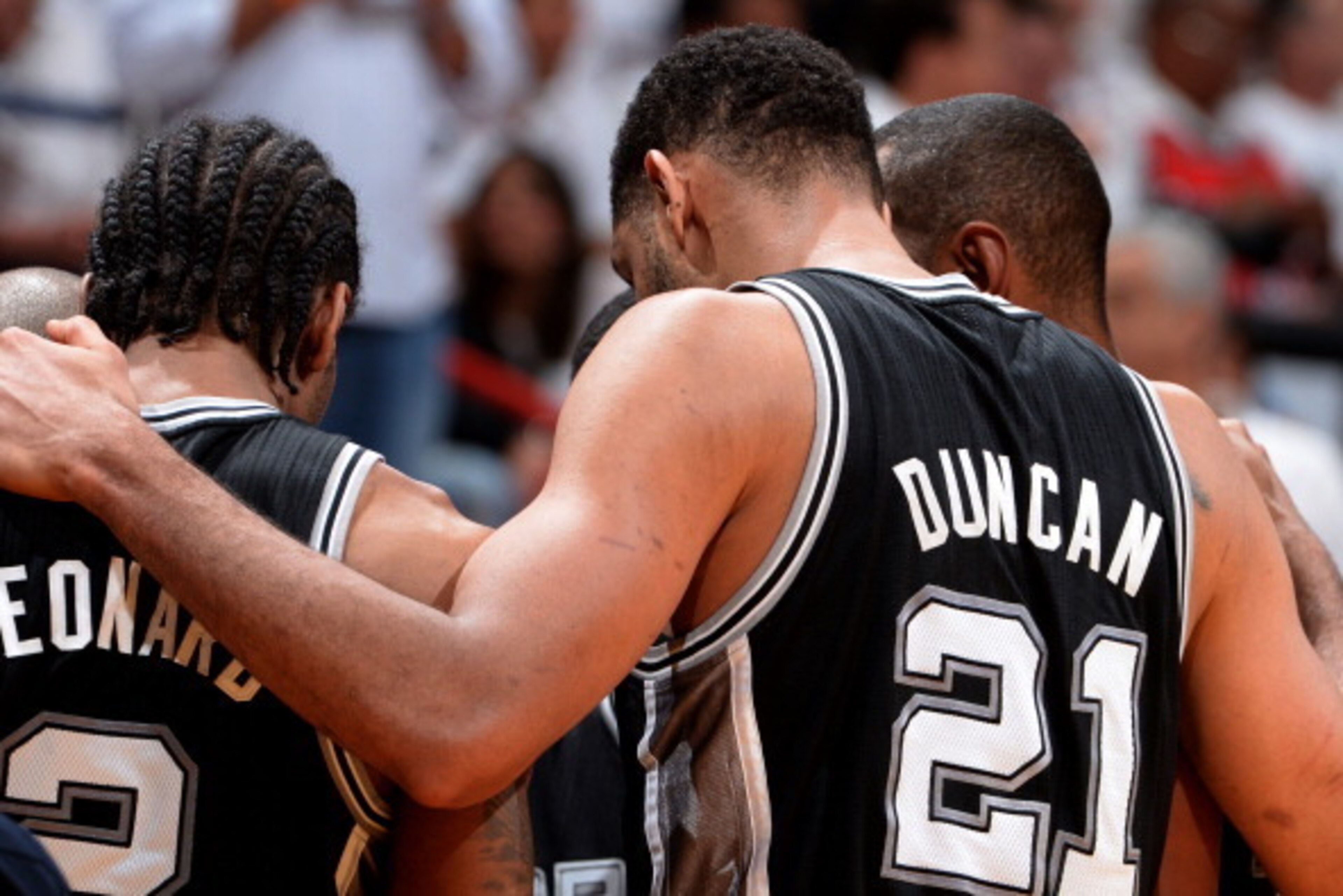 MIAMI, FL - JUNE 10: Kawhi Leonard #2 and Tim Duncan #21 of the San Antonio Spurs huddle during Game Three of the 2014 NBA Finals between the Miami Heat and San Antonio Spurs at the American Airlines Arena on June 10, 2014 in Miami, Florida. NOTE TO USER: