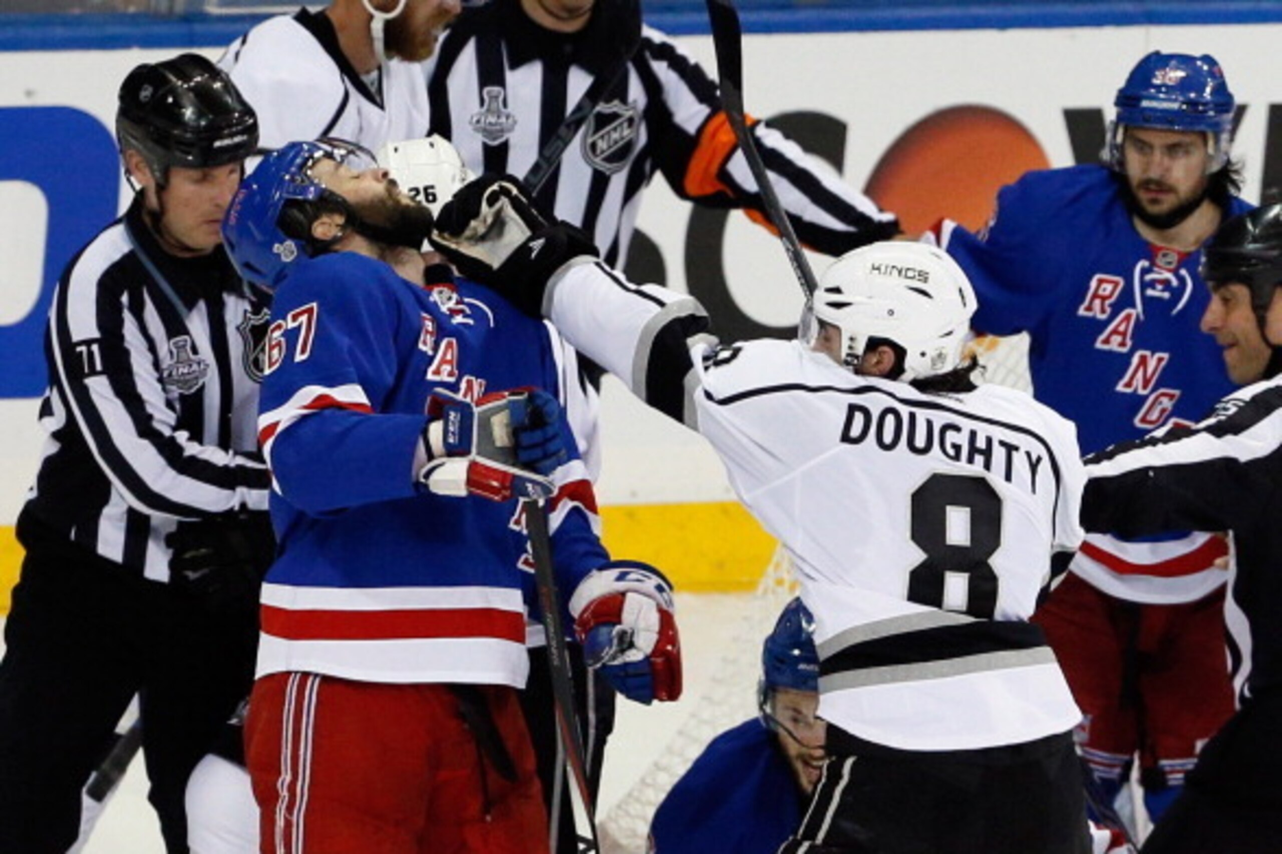 NEW YORK, NY - JUNE 11:  Drew Doughty #8 of the Los Angeles Kings shoves Benoit Pouliot #67 of the New York Rangers during the second period of Game Four of the 2014 NHL Stanley Cup Final at Madison Square Garden on June 11, 2014 in New York, New York.  (