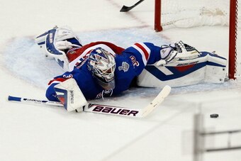 NEW YORK, NY - JUNE 11:  Henrik Lundqvist #30 of the New York Rangers tracks a rebound while lying on the ice after a play at the net during the second period of Game Four of the 2014 NHL Stanley Cup Final at Madison Square Garden on June 11, 2014 in New 
