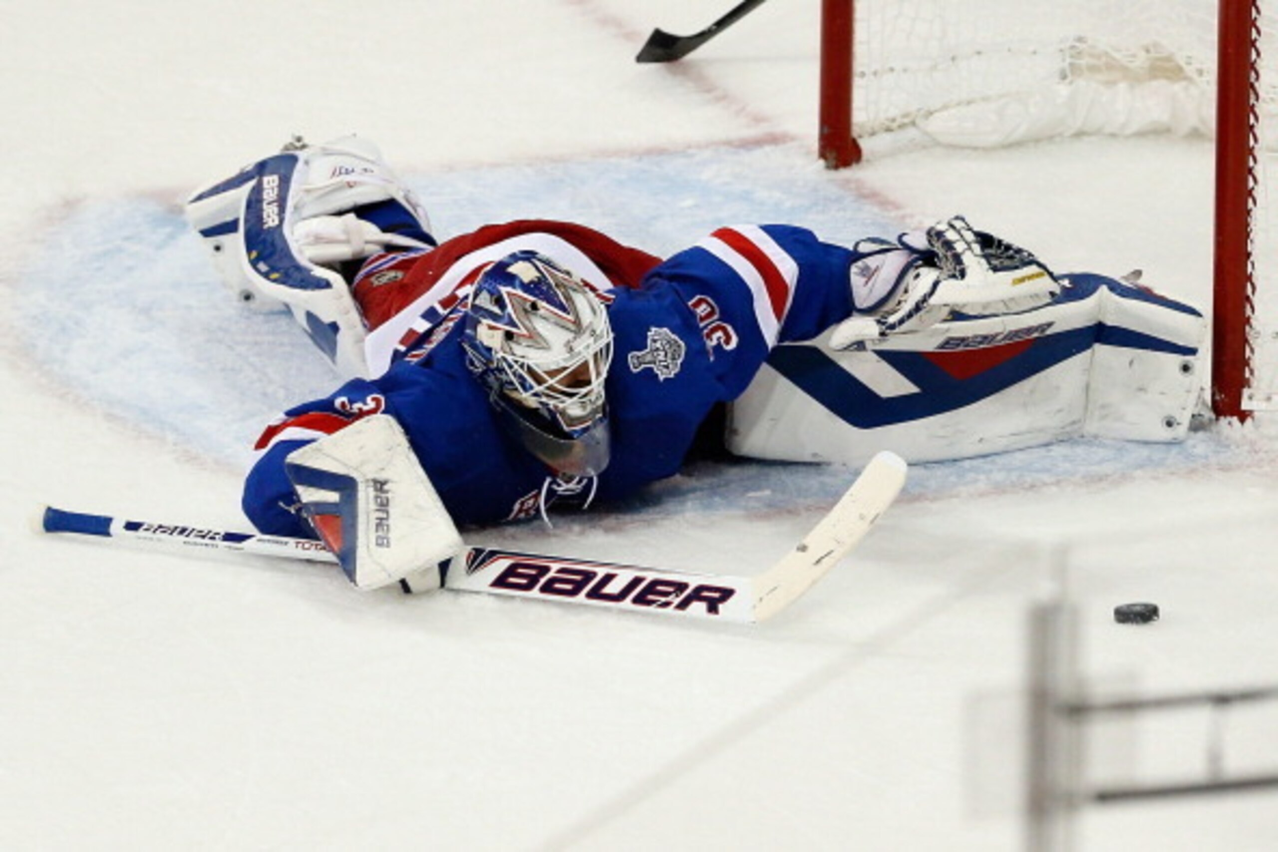 NEW YORK, NY - JUNE 11: Henrik Lundqvist #30 of the New York Rangers tracks a rebound while lying on the ice after a play at the net during the second period of Game Four of the 2014 NHL Stanley Cup Final at Madison Square Garden on June 11, 2014 in New NEW YORK, NY - JUNE 11: Henrik Lundqvist #30 of the New York Rangers tracks a rebound while lying on the ice after a play at the net during the second period of Game Four of the 2014 NHL Stanley Cup Final at Madison Square Garden on June 11, 2014 in New