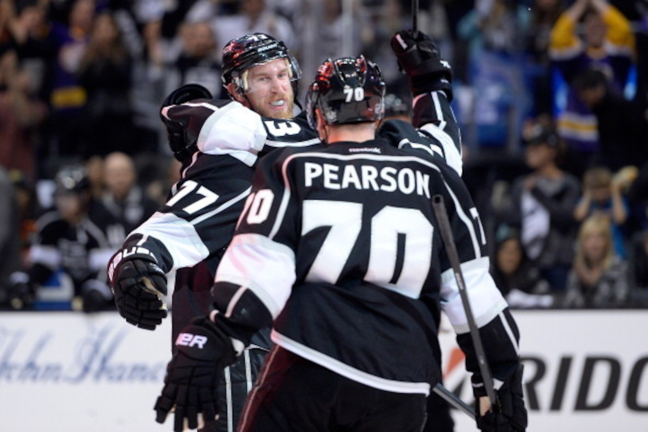 LOS ANGELES, CA - MAY 24:  Jeff Carter #77, Tanner Pearson #70 and Tyler Toffoli #73 of the Los Angeles Kings celebrate after Carter scores a second period goal against the Chicago Blackhawks in Game Three of the Western Conference Final during the 2014 S