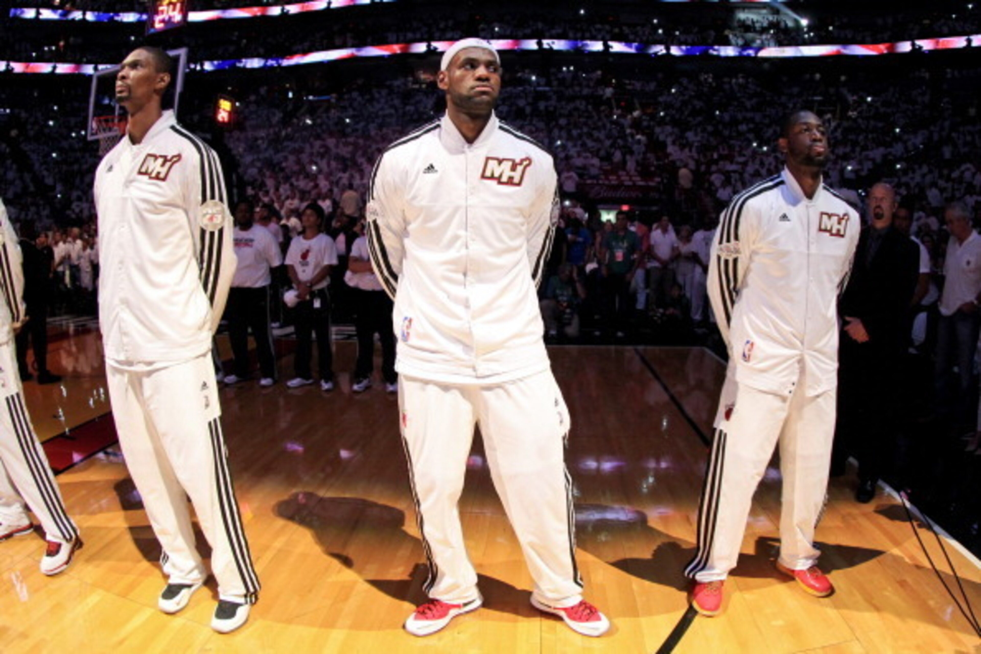 MIAMI, FL - JUNE 9: Miami Heat players, from left, Chris Bosh #1, LeBron James #6 and Dwyane Wade #3 listen to the National Anthem before playing against the San Antonio Spurs during Game Two of the 2013 NBA Finals on June 9, 2013 at American Airlines Are