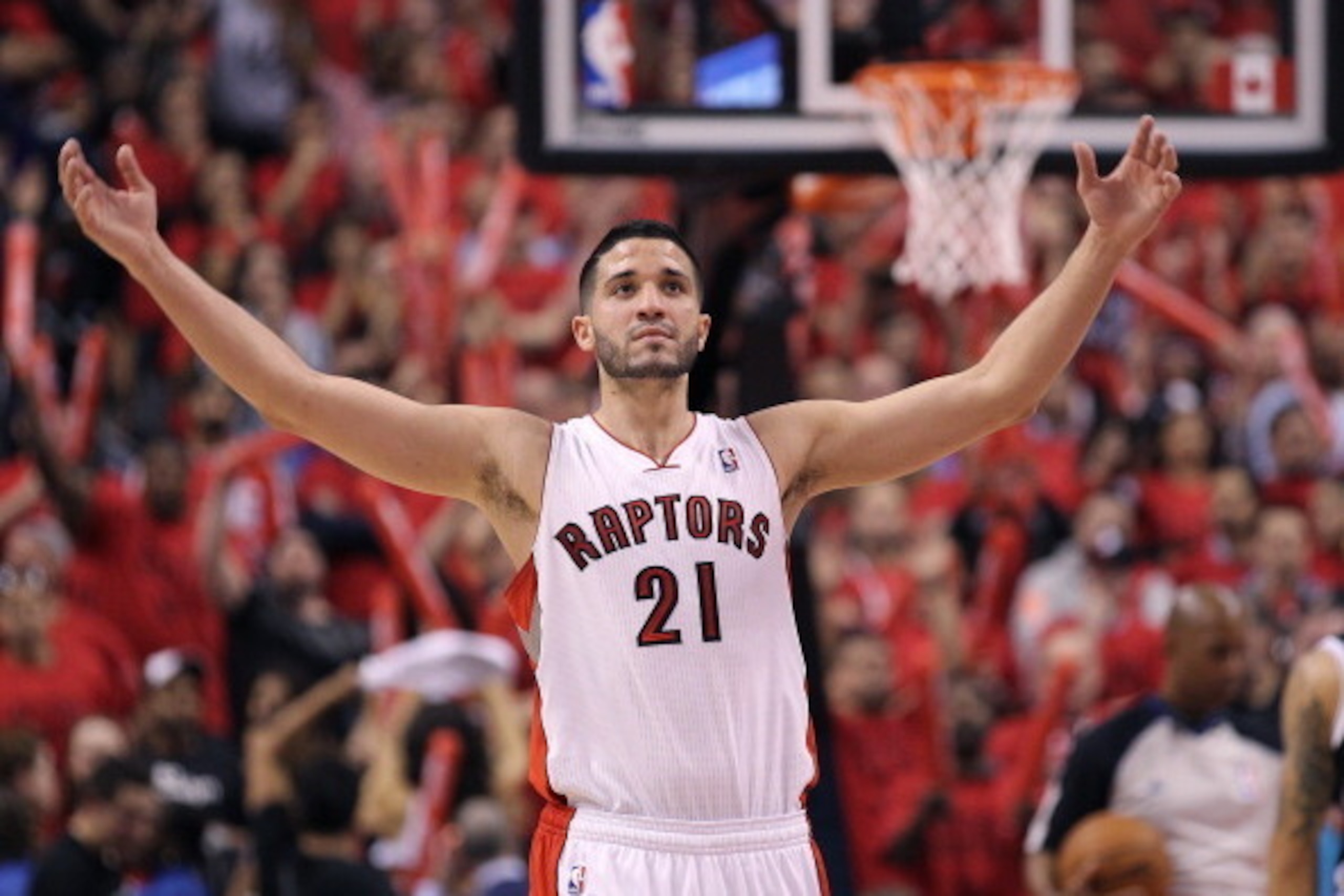 TORONTO, ON - MAY 4:  Greivis Vasquez #21 of the Toronto Raptors gets the crowd going against the Brooklyn Nets in Game Seven of the NBA Eastern Conference Quarterfinals at the Air Canada Centre on May 4, 2014 in Toronto, Ontario, Canada. The Nets defeate
