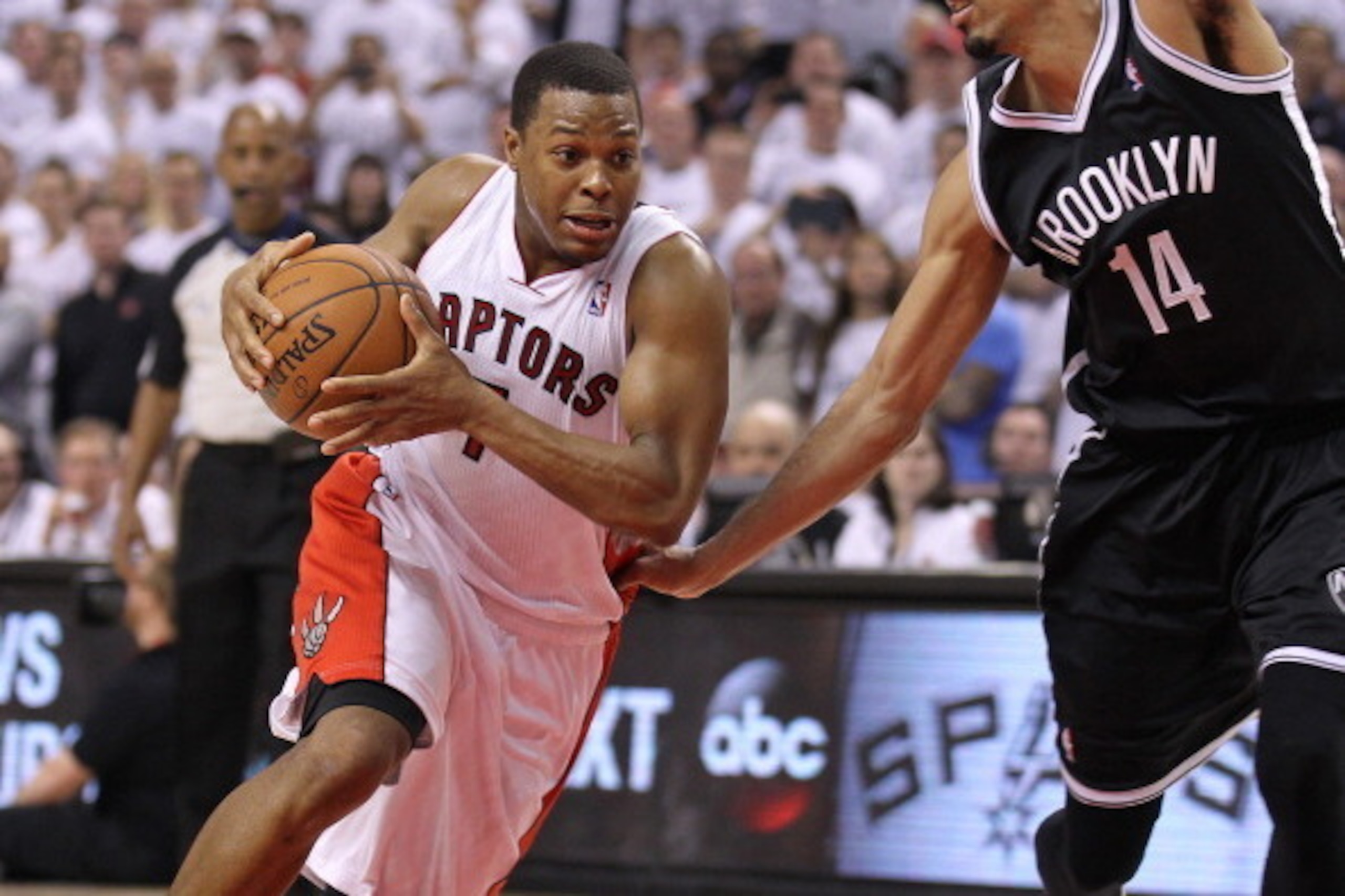 TORONTO, ON - MAY4:  Kyle Lowry #7 of the Toronto Raptors drives around Shaun Livingston #14 of the Brooklyn Nets in Game Seven of the NBA Eastern Conference Quarterfinals at the Air Canada Centre on May 4, 2014 in Toronto, Ontario, Canada. The Nets defea