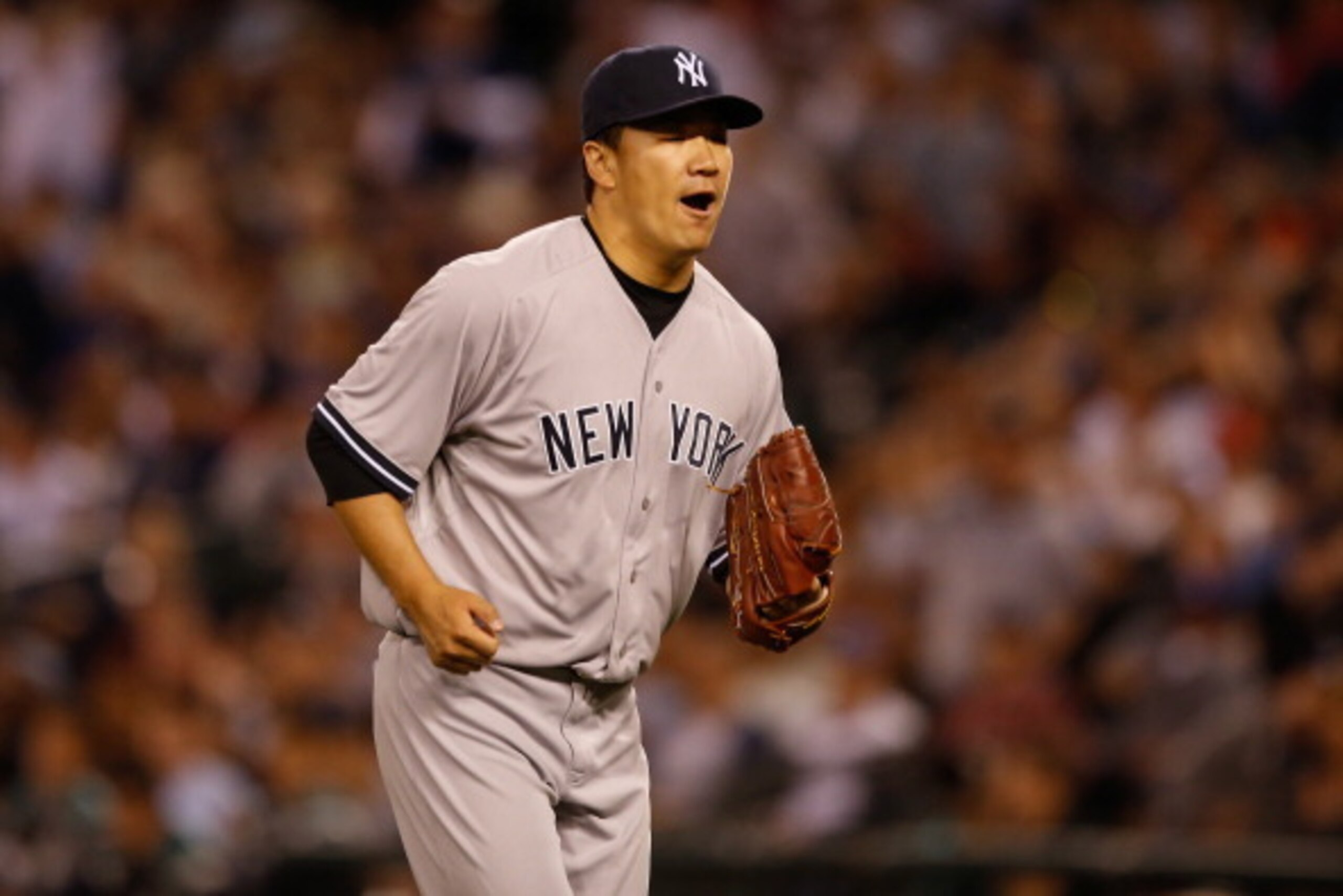 SEATTLE, WA - JUNE 11:  Starting pitcher Masahiro Tanaka #19 of the New York Yankees reacts as he comes off the field following a double play to end the eighth inning against the Seattle Mariners at Safeco Field on June 11, 2014 in Seattle, Washington.  (