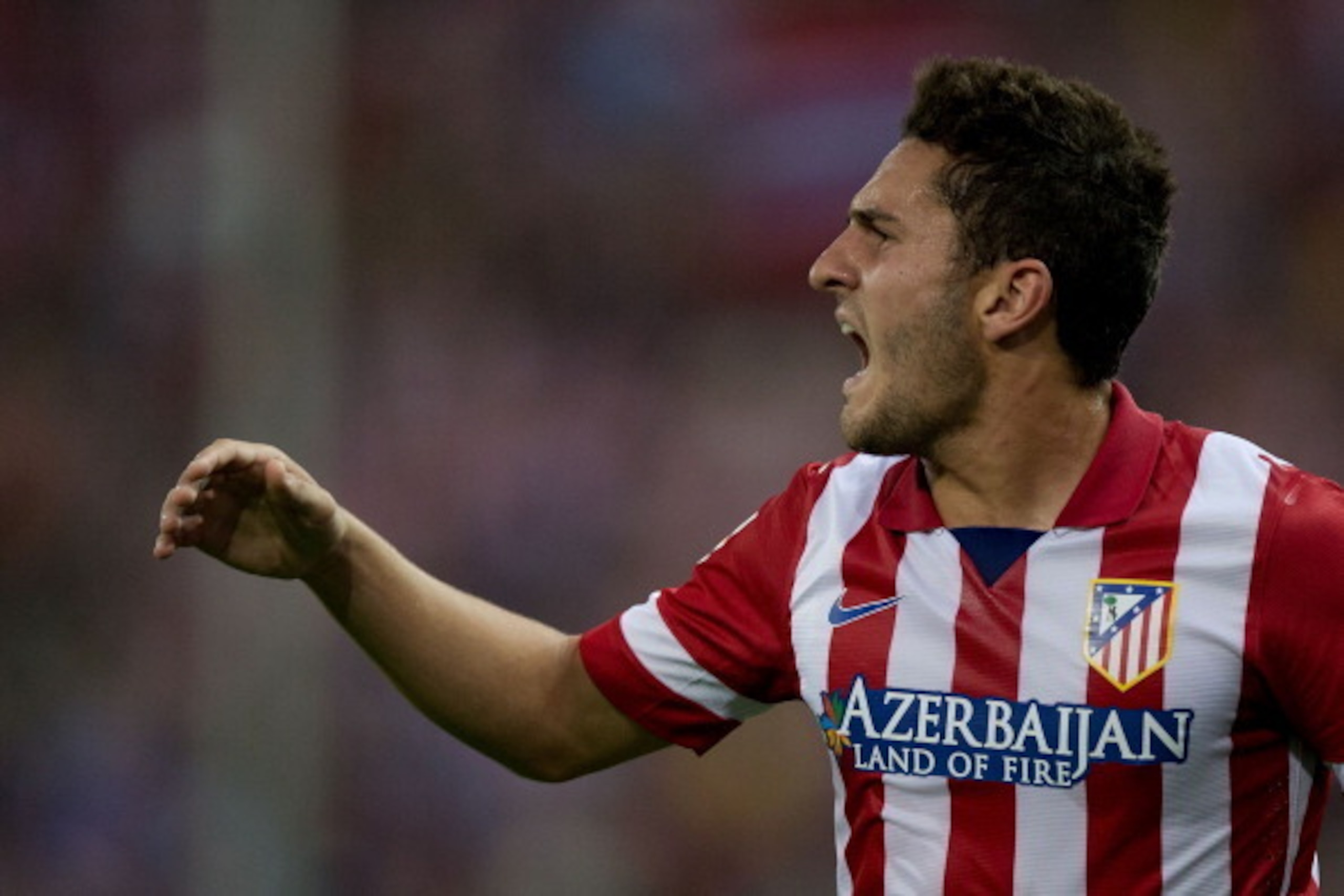 MADRID, SPAIN - APRIL 18: Koke of Atletico de Madrid protests to the referee during the La Liga match between Club Atletico de Madrid and Elche FC at Vicente Calderon Stadium on April 18, 2014 in Madrid, Spain.  (Photo by Gonzalo Arroyo Moreno/Getty Image