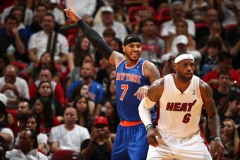 MIAMI, FL - APRIL 6: LeBron James #6 of the Miami Heat defends Carmelo Anthony #7 of the New York Knicks as he calls for the ball during a game on April 6, 2014 at American Airlines Arena in Miami, Florida.  NOTE TO USER: User expressly acknowledges and a