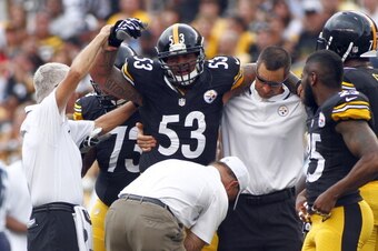 PITTSBURGH, PA - SEPTEMBER 08:  Maurkice Pouncey #53 of the Pittsburgh Steelers is tended to by medical staff in the first half during the game against the Tennessee Titans on September 8, 2013 at Heinz Field in Pittsburgh, Pennsylvania.  (Photo by Justin