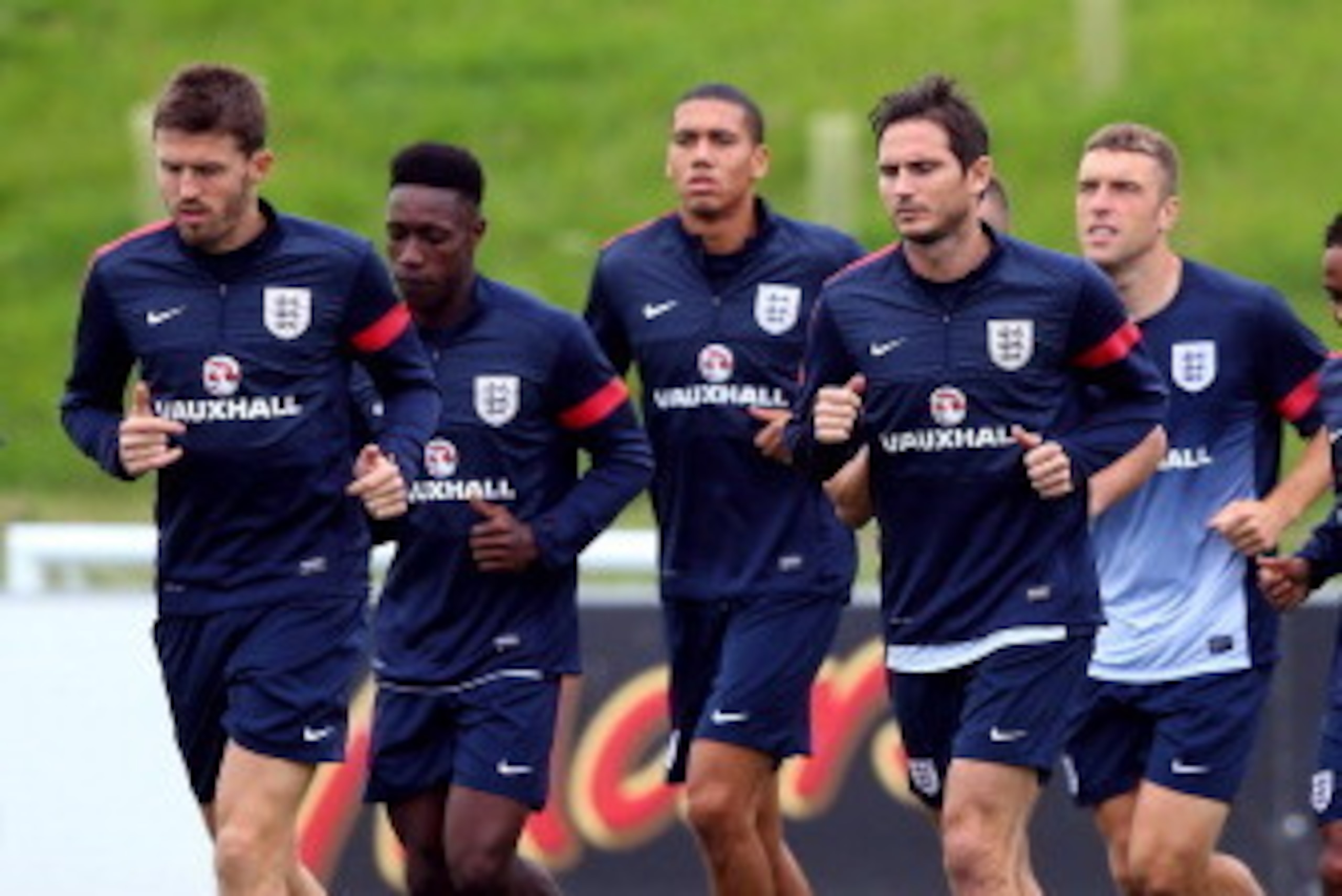 BURTON-UPON-TRENT, ENGLAND - SEPTEMBER 03:  Frank Lampard and Michael Carrick of England lead the warm up during a training session at St Georges Park on September 3, 2013 in Burton-upon-Trent, England.  (Photo by Alex Livesey/Getty Images)