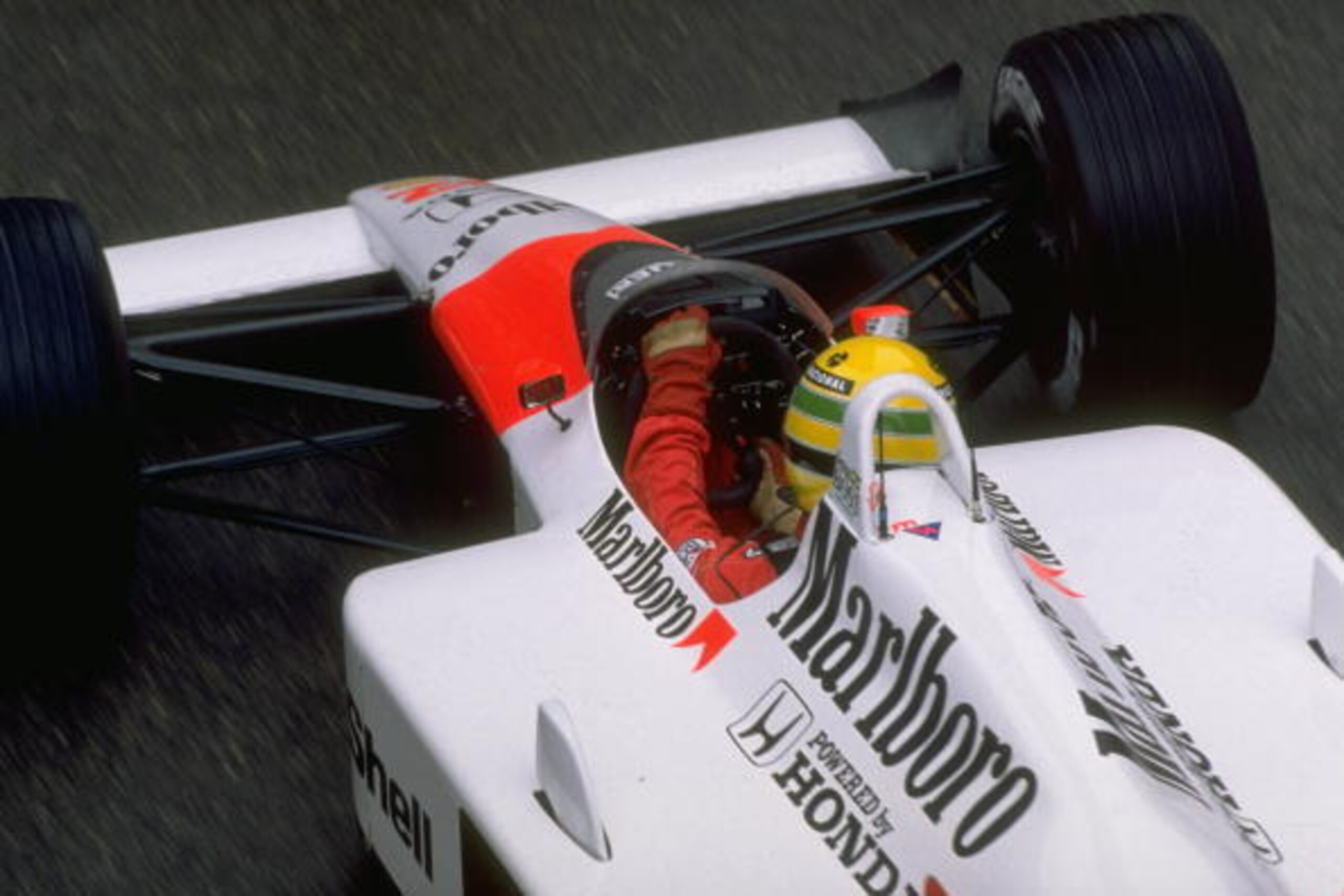 1988:  Rear view of Ayrton Senna of Brazil in his McLaren Honda before the Monaco Grand Prix at the Monte Carlo circuit in Monaco. Senna retired from the race after hitting a barrier. \ Mandatory Credit: Allsport UK /Allsport