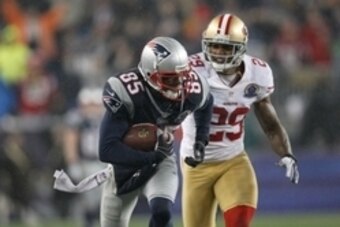 Dec 16, 2012; Foxboro, Massachusetts, USA; New England Patriots wide receiver Brandon Lloyd (85) makes a reception while defended by San Francisco 49ers defensive back Chris Culliver (29) during the fourth quarter at Gillette Stadium. The San Francisco 49
