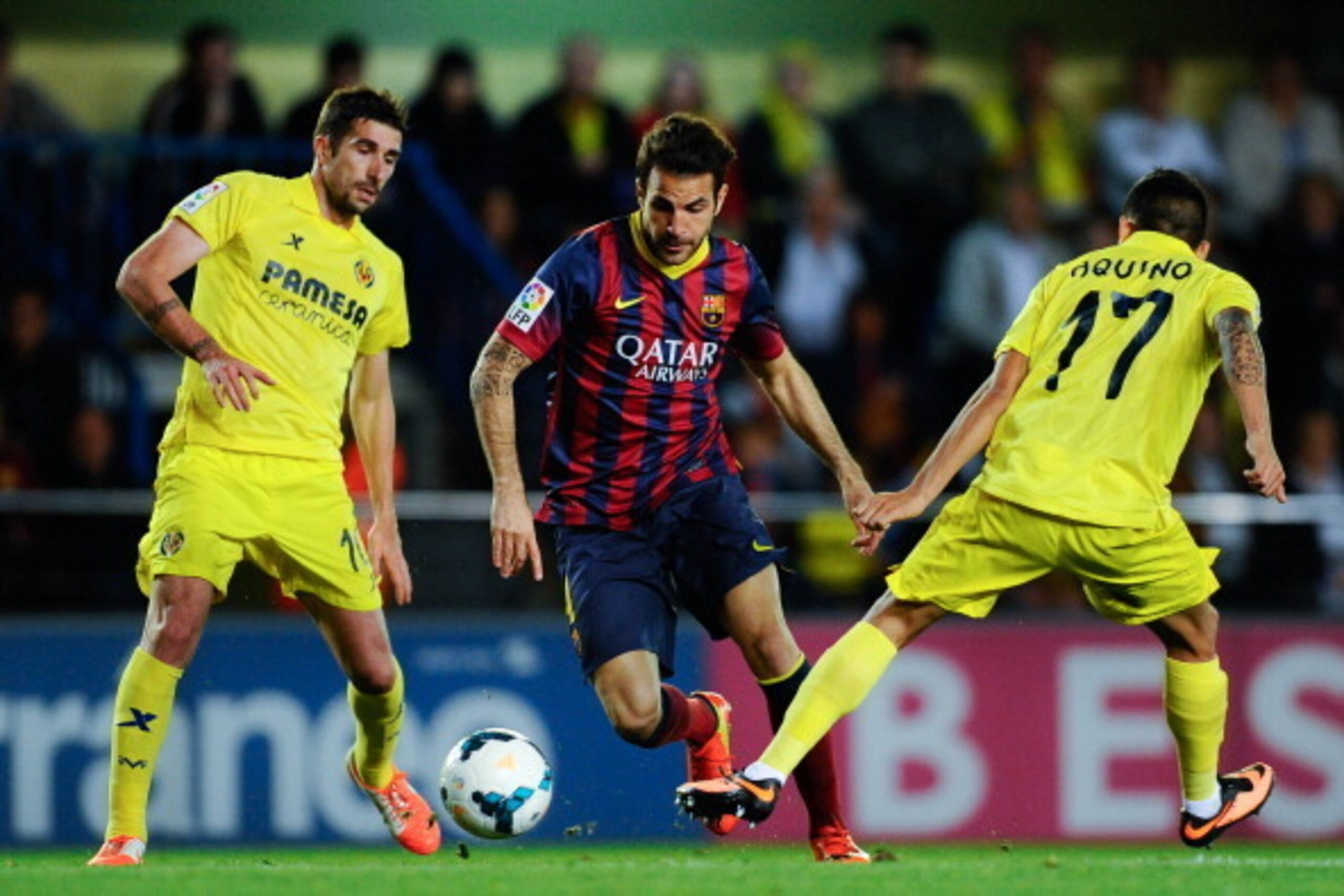 VILLARREAL, SPAIN - APRIL 27:  Cesc Fabregas of FC Barcelona competes for the ball with Cani (L) and Javier Aquino of Villarreal CF during the La Liga match between Villarreal CF and FC Barcelona at El Madrigal on April 27, 2014 in Villarreal, Spain.  (Ph