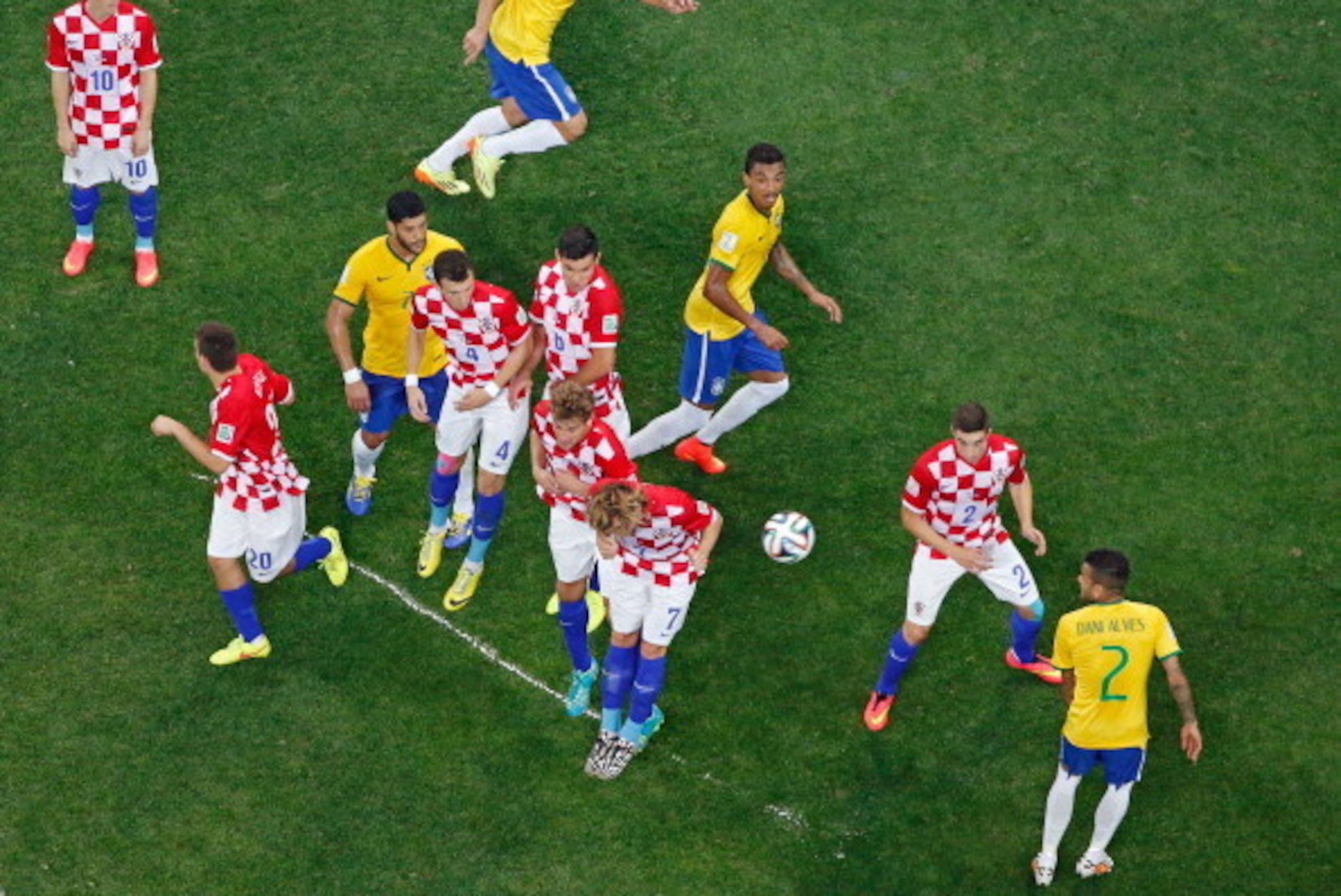 SAO PAULO, BRAZIL - JUNE 12: Brazil and Croatia react to a free kick after forming a wall on a temporary line sprayed on the field by the referee in the first half during the 2014 FIFA World Cup Brazil Group A match between Brazil and Croatia at Arena de 