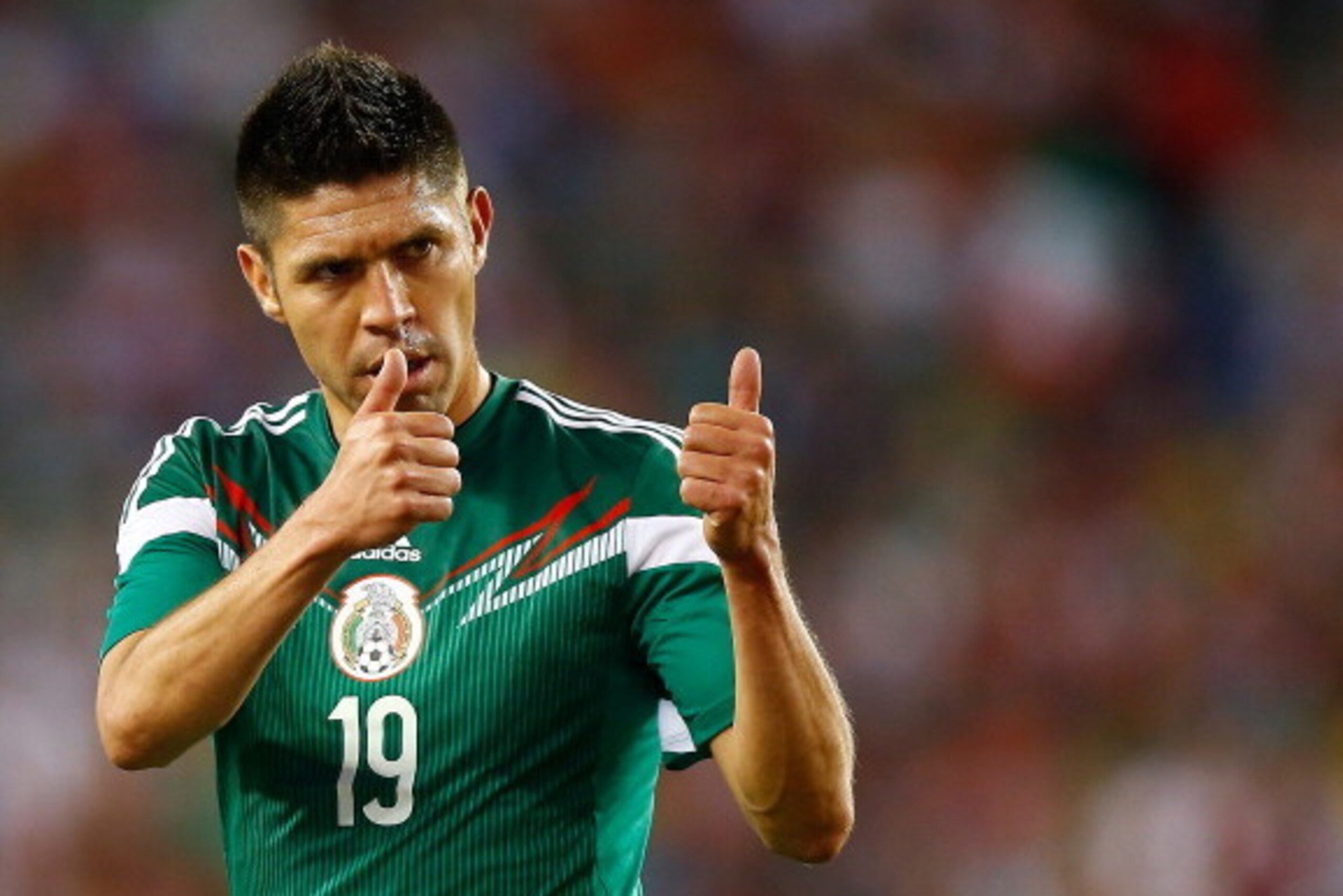 FOXBORO, MA - JUNE 06: Oribe Peralta #19 of Mexico reacts to a teammate during a corner kick against Portugal in the second half during the international friendly match at Gillette Stadium on June 6, 2014 in Foxboro, Massachusetts.  (Photo by Jared Wicker