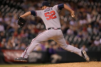 DENVER, CO - JUNE 10:  Relief pitcher Jordan Walden #52 of the Atlanta Braves delivers against the Colorado Rockies at Coors Field on June 10, 2014 in Denver, Colorado. The Braves defeated the Rockies 13-10.  (Photo by Doug Pensinger/Getty Images)