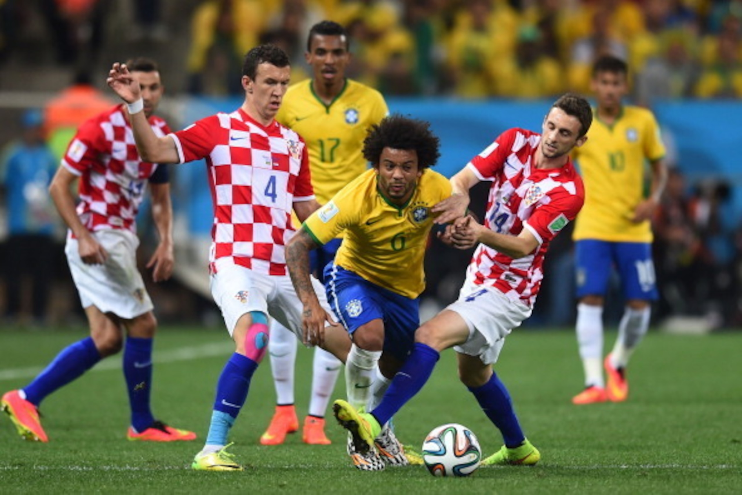 SAO PAULO, BRAZIL - JUNE 12: Marcelo Brozovic of Croatia challenges Marcelo of Brazil during the 2014 FIFA World Cup Brazil Group A match between Brazil and Croatia at Arena de Sao Paulo on June 12, 2014 in Sao Paulo, Brazil.  (Photo by Christopher Lee/Ge