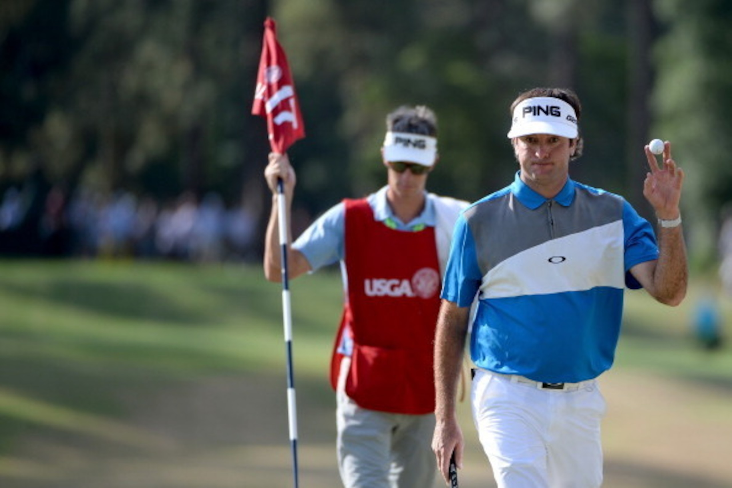 PINEHURST, NC - JUNE 12:  Bubba Watson of the United States waves to the gallery on the 17th hole during the first round of the 114th U.S. Open at Pinehurst Resort & Country Club, Course No. 2 on June 12, 2014 in Pinehurst, North Carolina.  (Photo by Ross