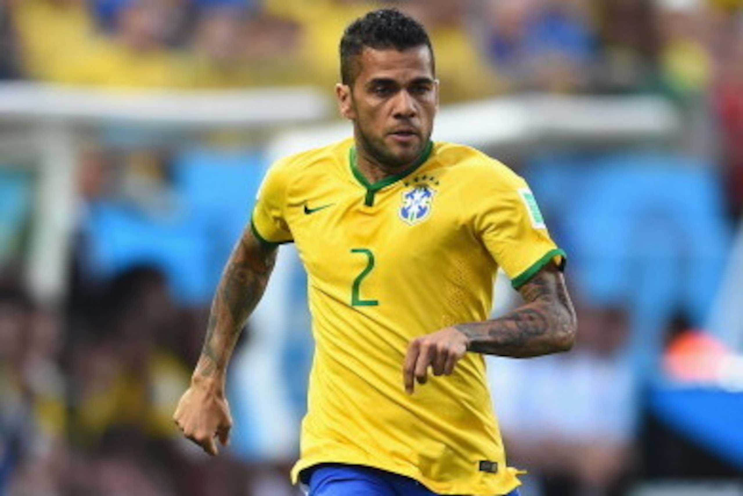 SAO PAULO, BRAZIL - JUNE 12:  Dani Alves of Brazil in action during the 2014 FIFA World Cup Brazil Group A match between Brazil and Croatia at Arena de Sao Paulo on June 12, 2014 in Sao Paulo, Brazil.  (Photo by Buda Mendes/Getty Images)