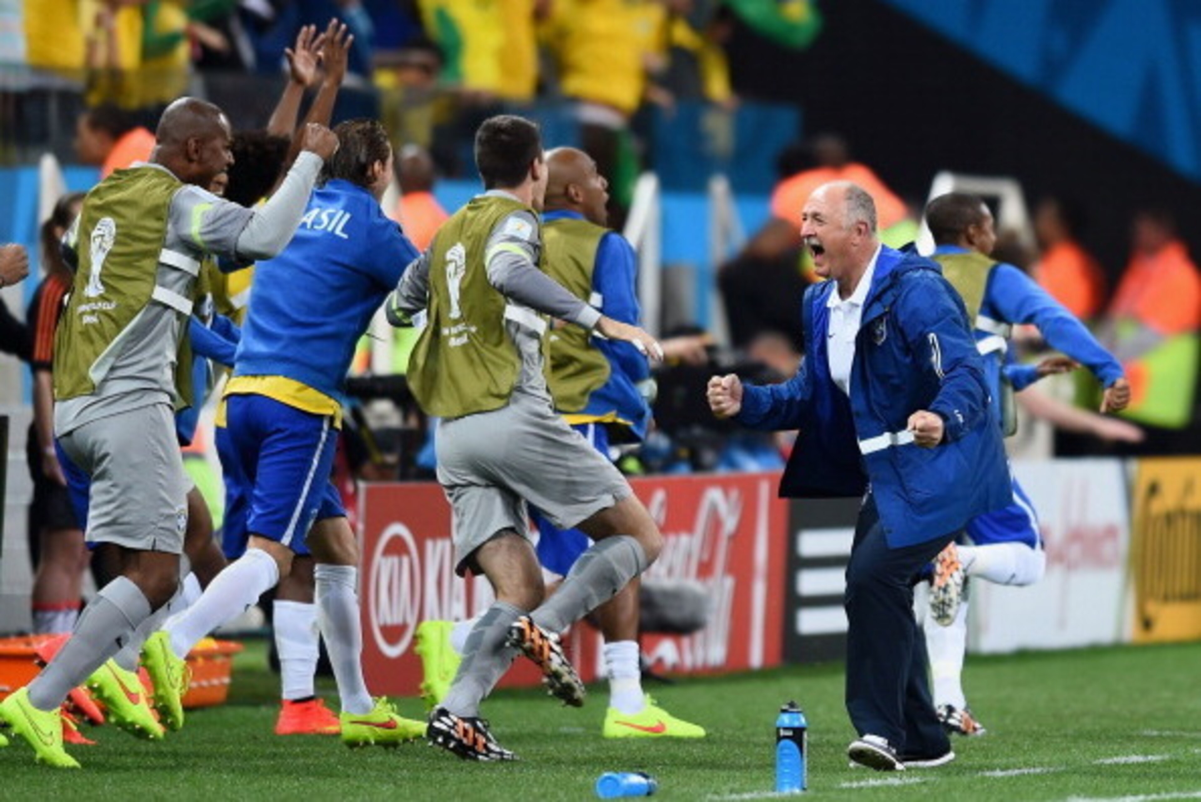 SAO PAULO, BRAZIL - JUNE 12:  Head coach Luiz Felipe Scolari of Brazil (R) celebrates with his team during the 2014 FIFA World Cup Brazil Group A match between Brazil and Croatia at Arena de Sao Paulo on June 12, 2014 in Sao Paulo, Brazil.  (Photo by Chri