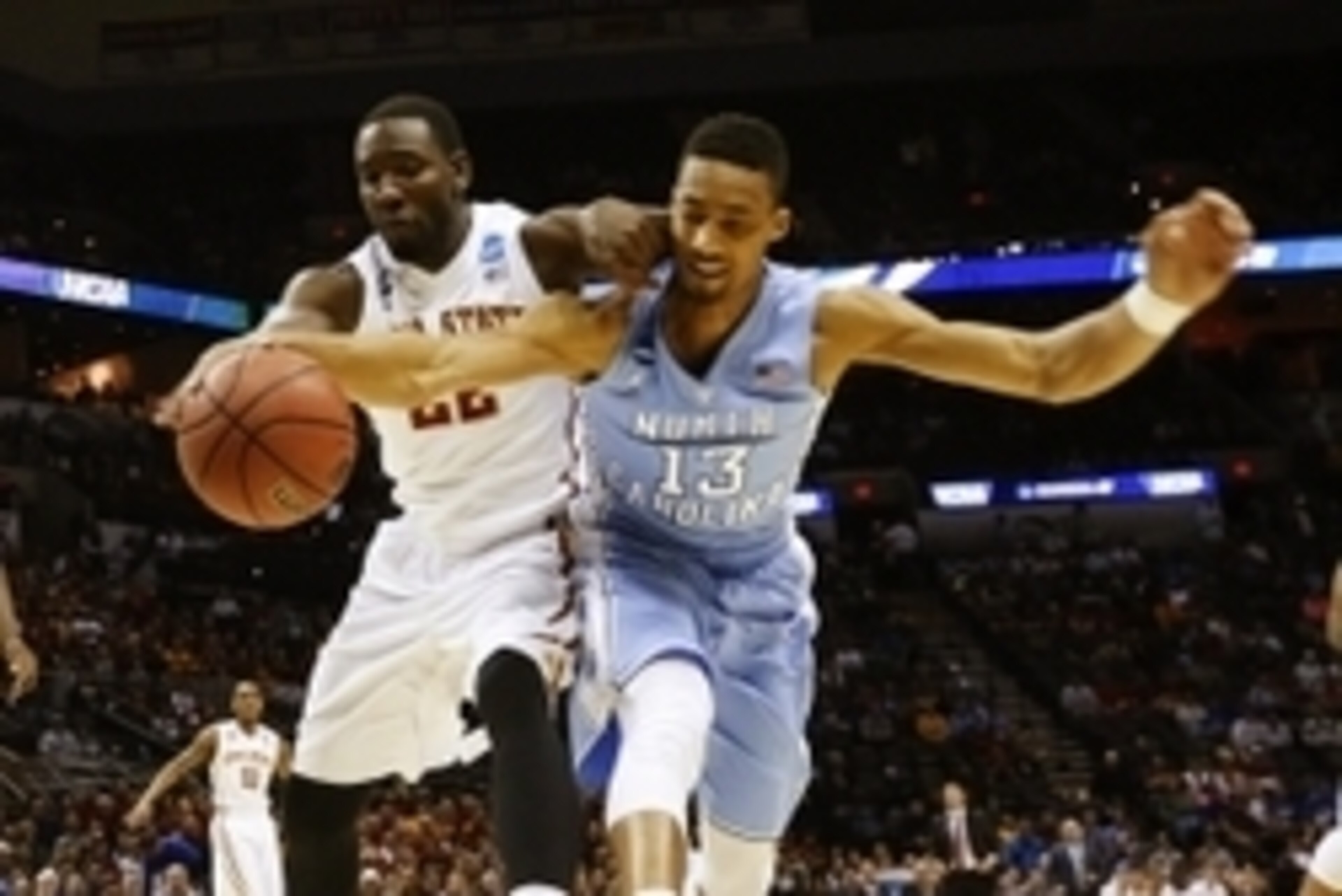 Mar 23, 2014; San Antonio, TX, USA; Iowa State Cyclones forward Dustin Hogue (22) defends against North Carolina Tar Heels forward J.P. Tokoto (13) in the second half of a men's college basketball game during the third round of the 2014 NCAA Tournament at Mar 23, 2014; San Antonio, TX, USA; Iowa State Cyclones forward Dustin Hogue (22) defends against North Carolina Tar Heels forward J.P. Tokoto (13) in the second half of a men's college basketball game during the third round of the 2014 NCAA Tournament at