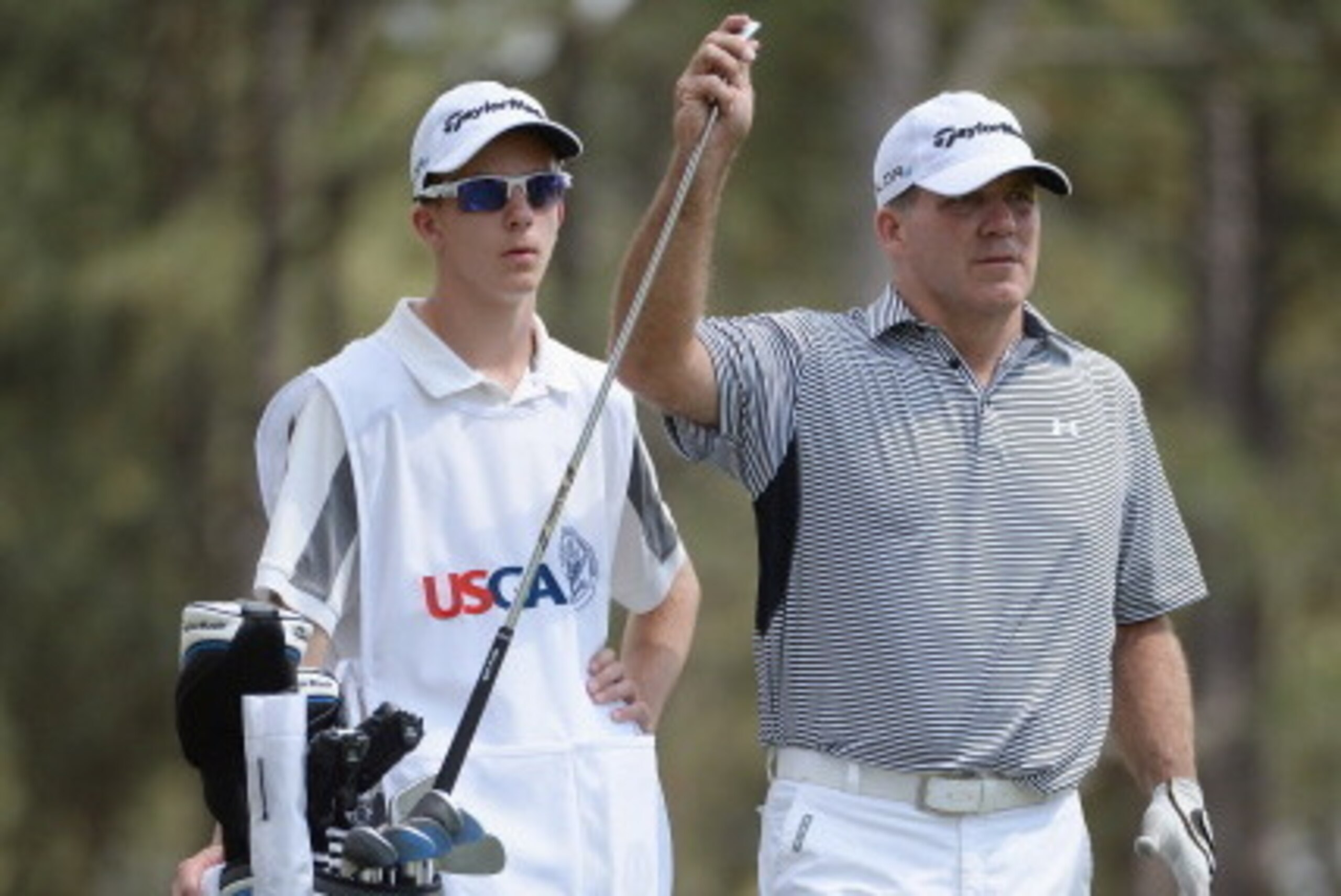 PINEHURST, NC - JUNE 12: Fran Quinn of the United States pulls a club alongside his caddie Owen Quinn on the 15th tee during the first round of the 114th U.S. Open at Pinehurst Resort & Country Club, Course No. 2 on June 12, 2014 in Pinehurst, North Carol